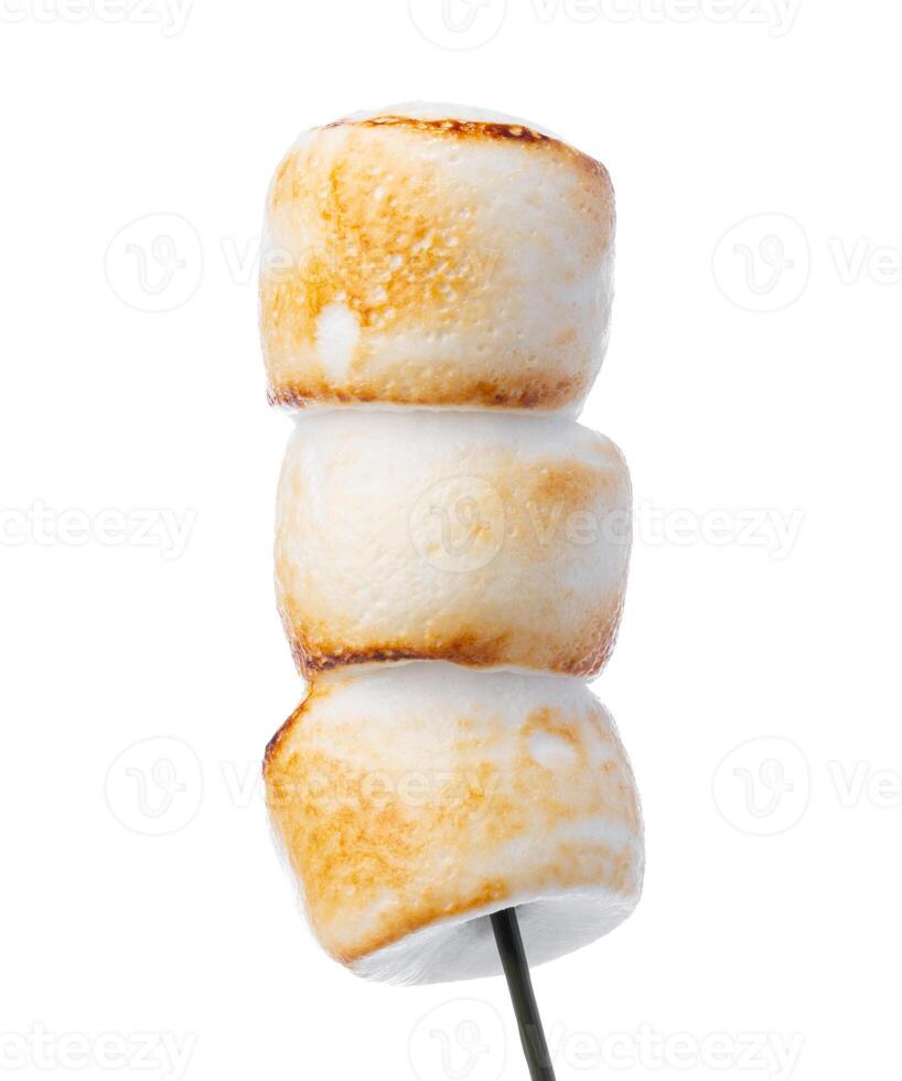 Grilled marshmallows on sticks isolated on white photo