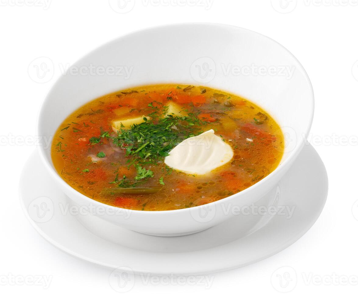 Chicken soup in bowl on white background photo