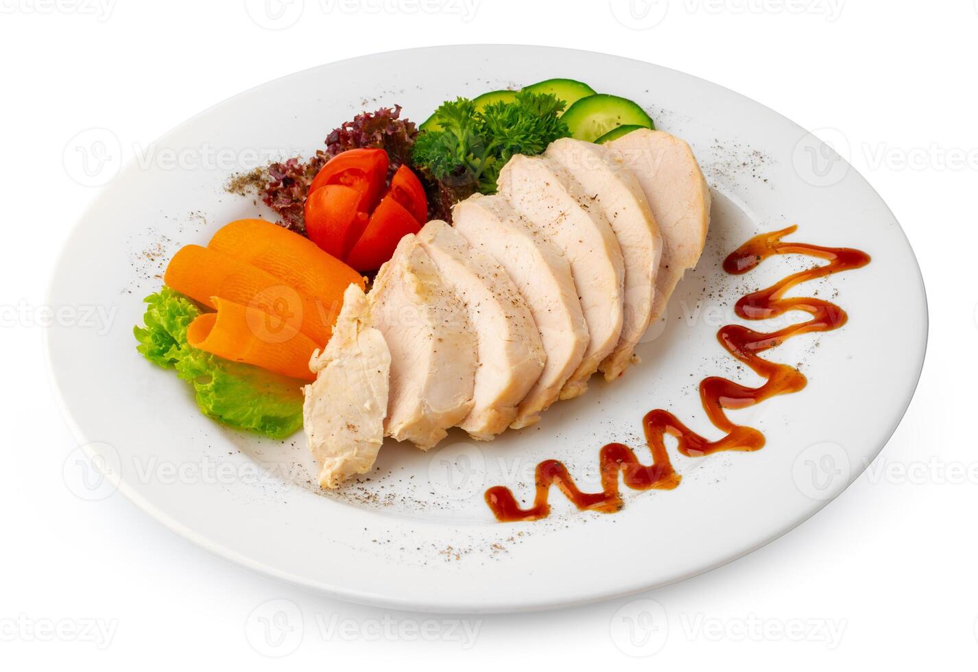 Pieces of boiled chicken breast with vegetables over white background photo