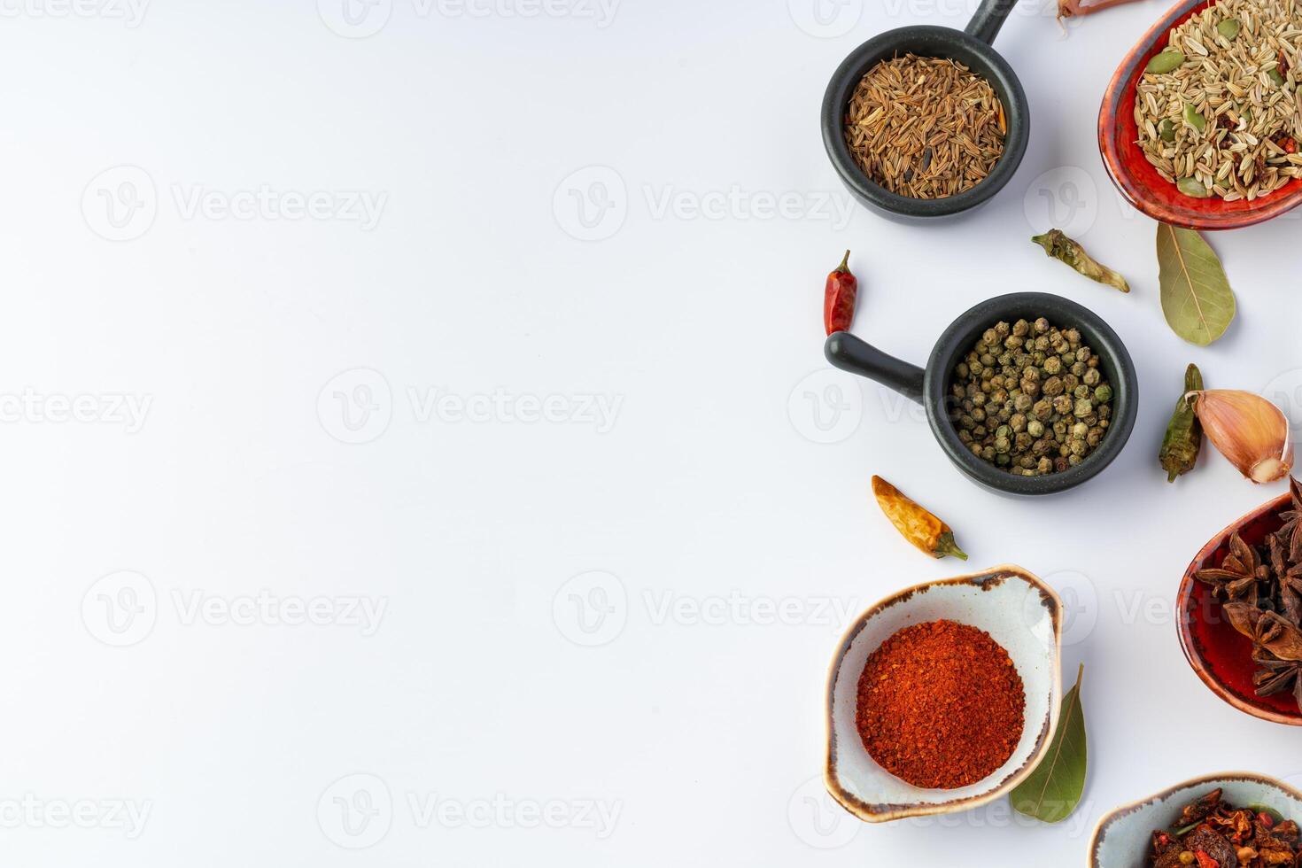 Bowls with various spices on white background photo
