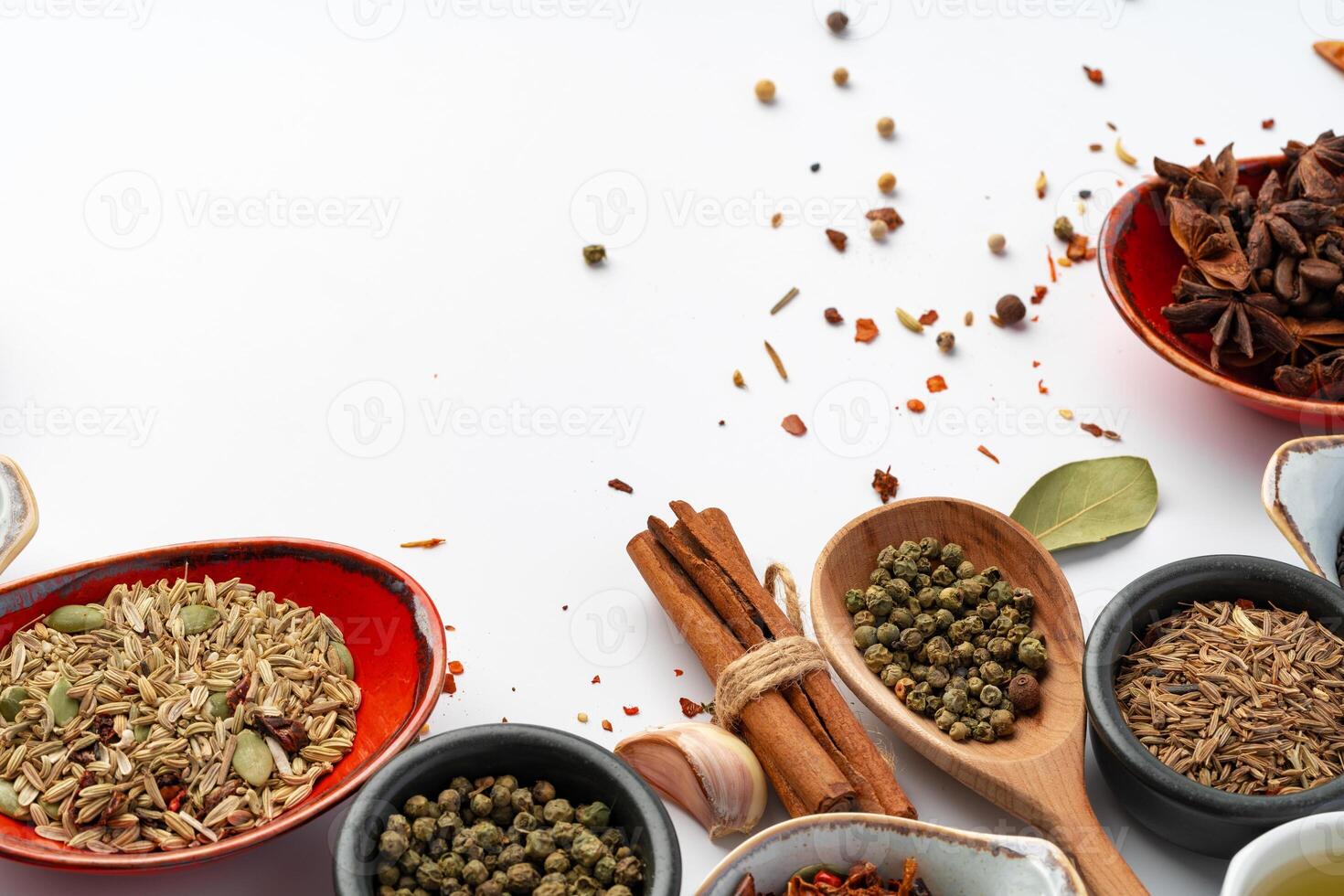 Bowls with various spices on white background photo