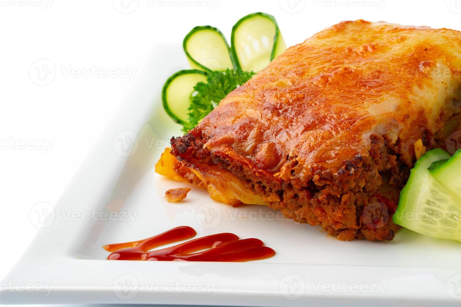 Meat with melting slice of cheese isolated on white background. photo