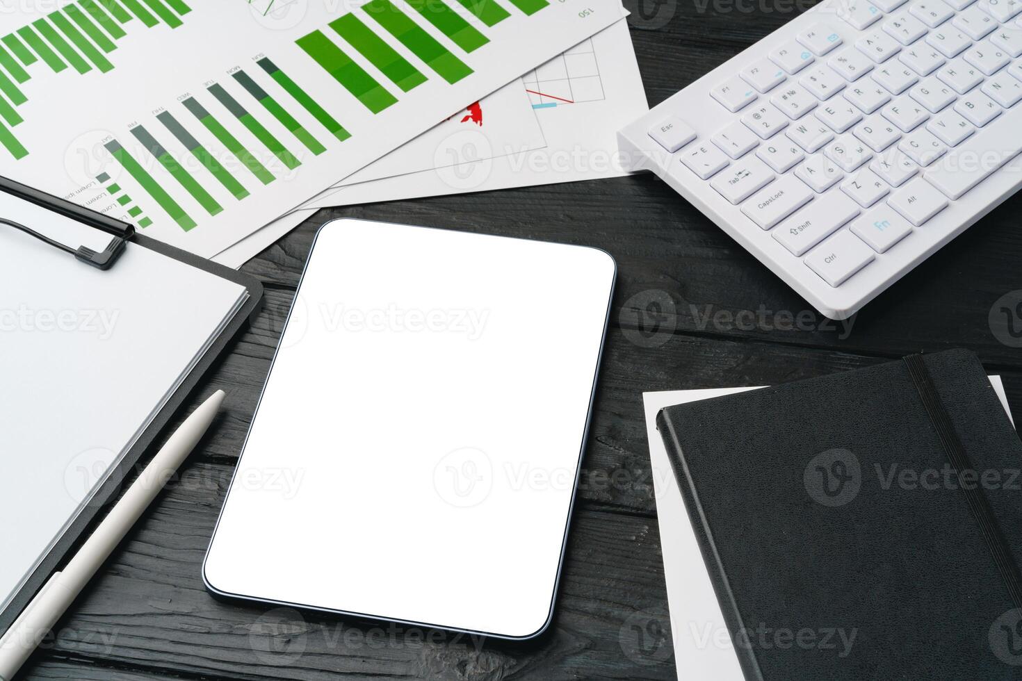 Office supplies and digital tablet on office table photo