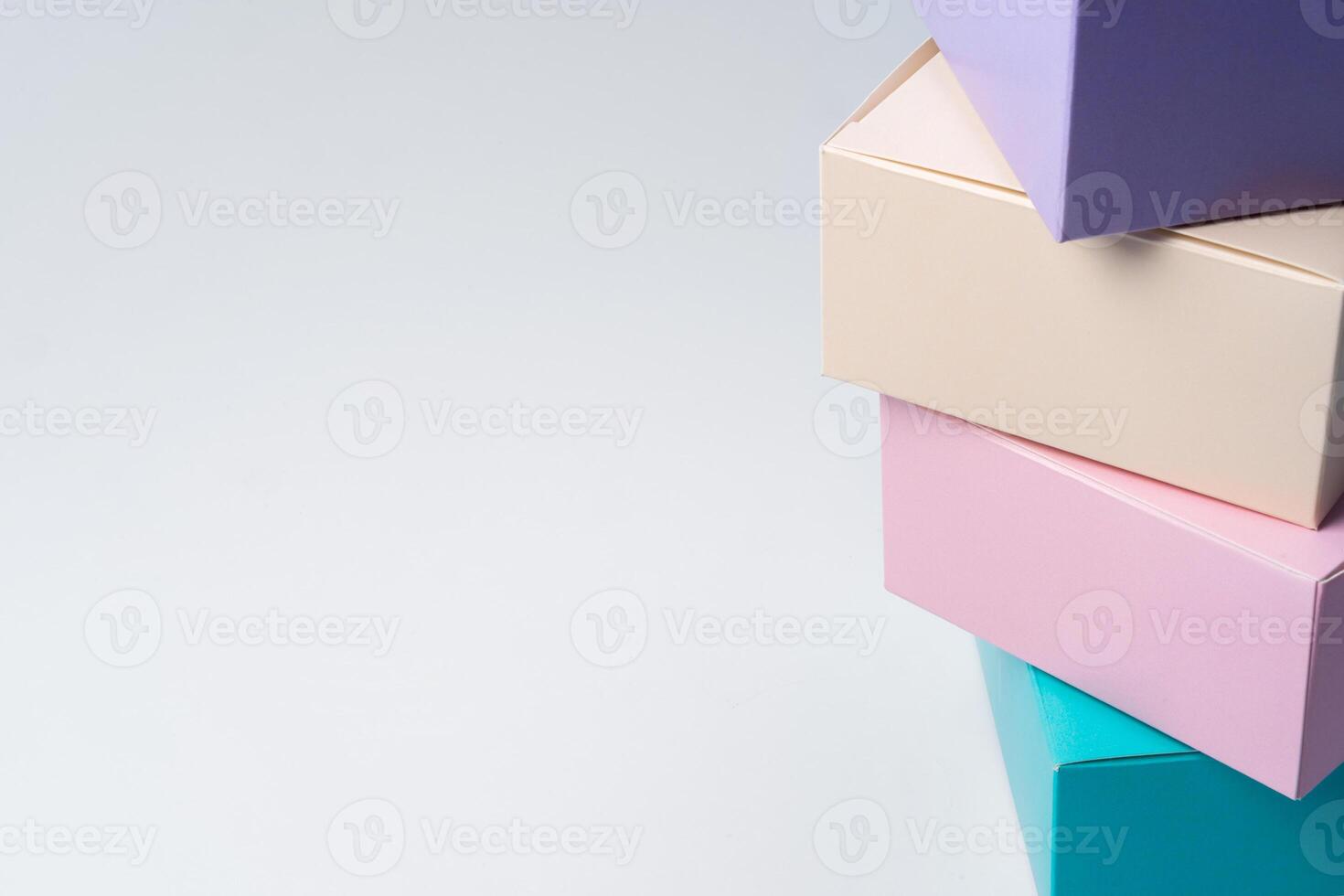 Pile of colorful cardboard boxes on white background photo