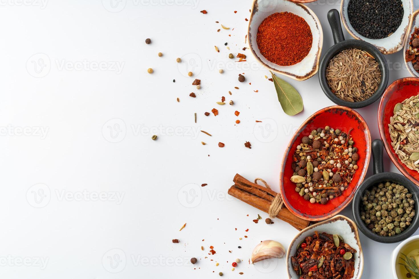 Bowls with various spices on white background photo