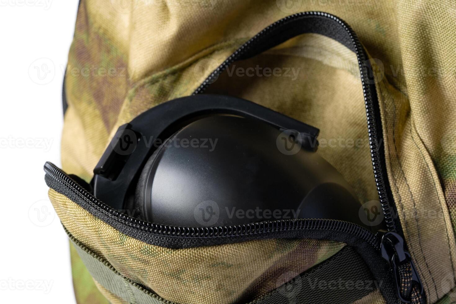 Open military backpack of khaki color on a white background photo