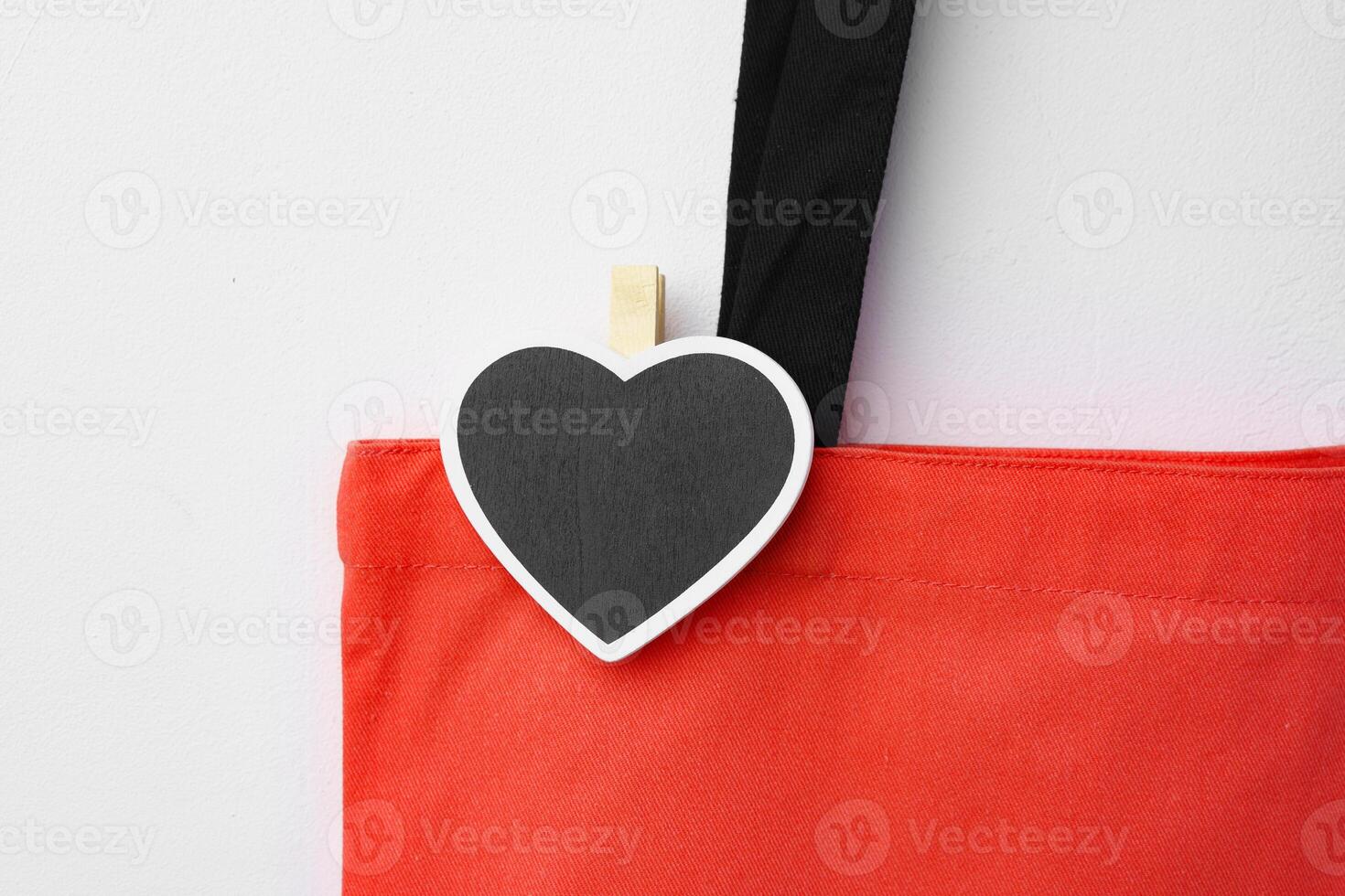Cotton tote shopper bag with heart tag on white background photo