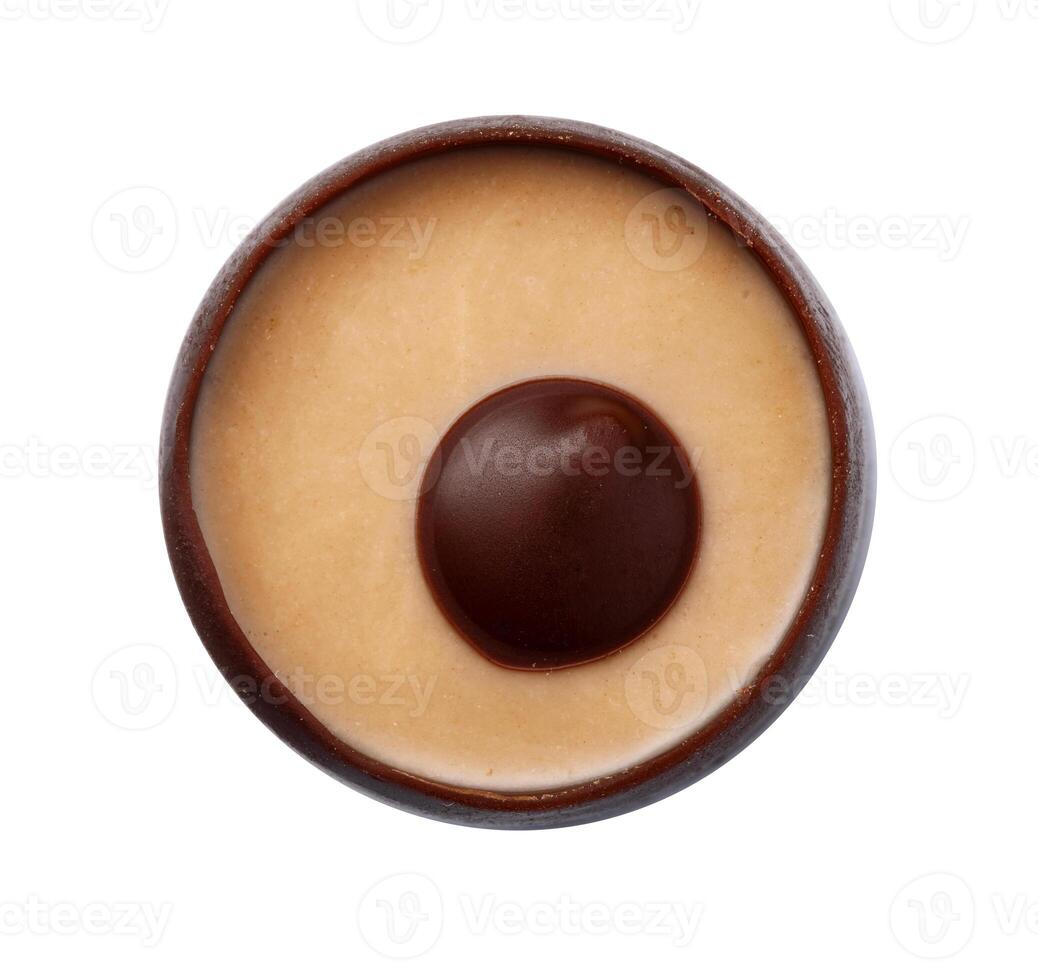 Delicious chocolate candy isolated on white, top view photo