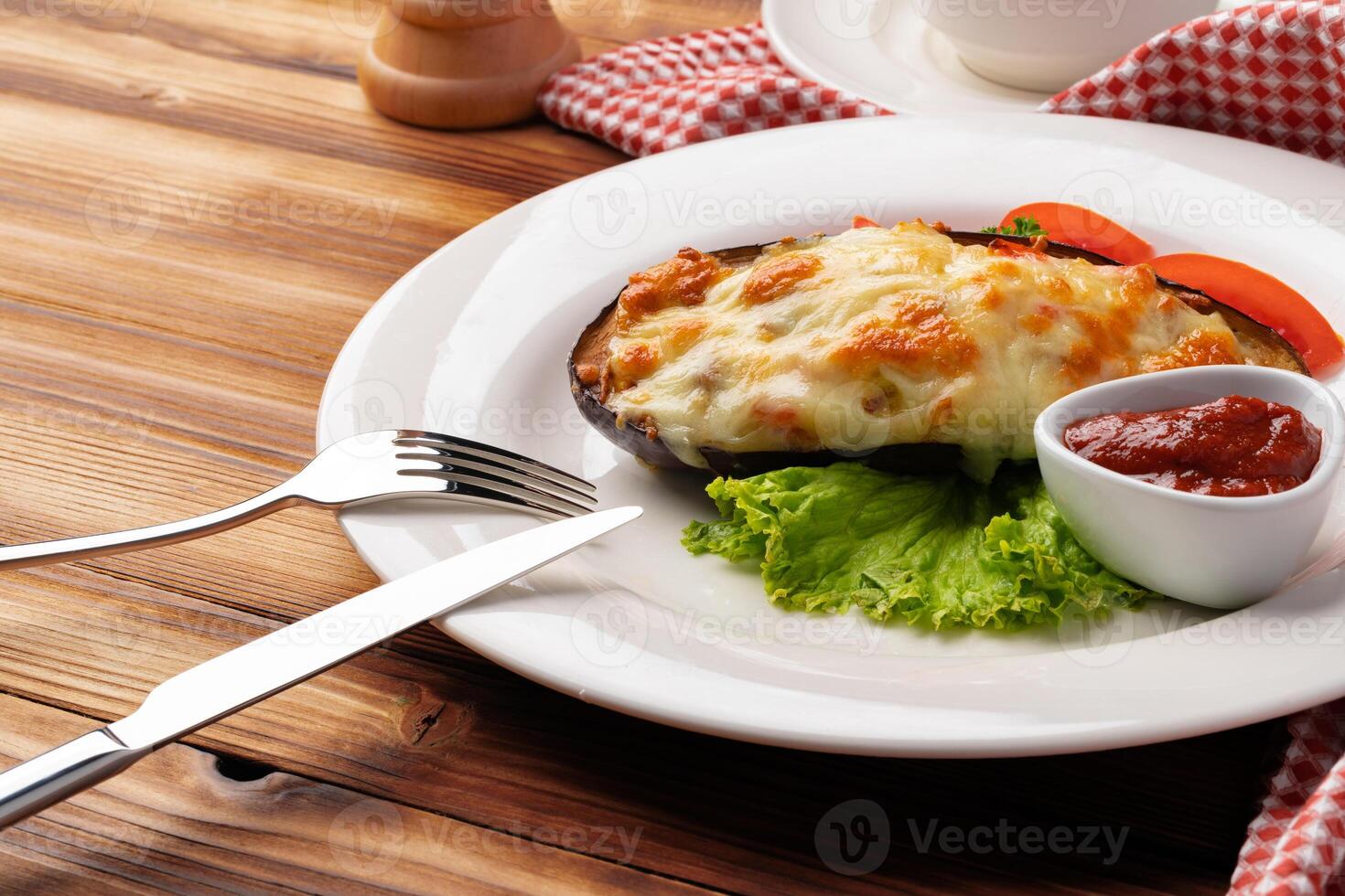 Big mussel baked with cheese on white plate photo