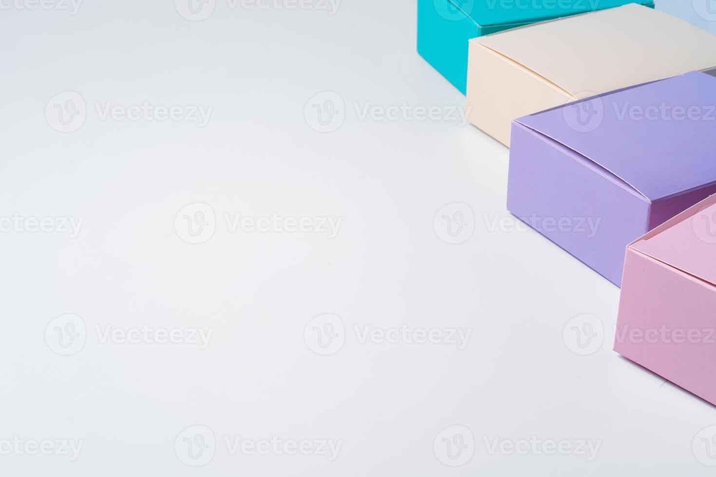 Pile of colorful cardboard boxes on white background photo