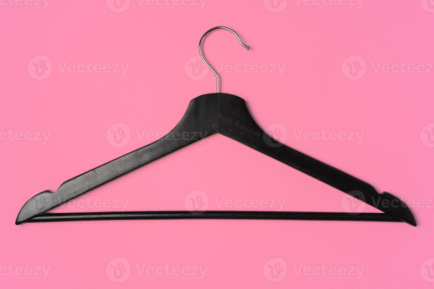 Flat lay composition with empty hangers on pink background photo