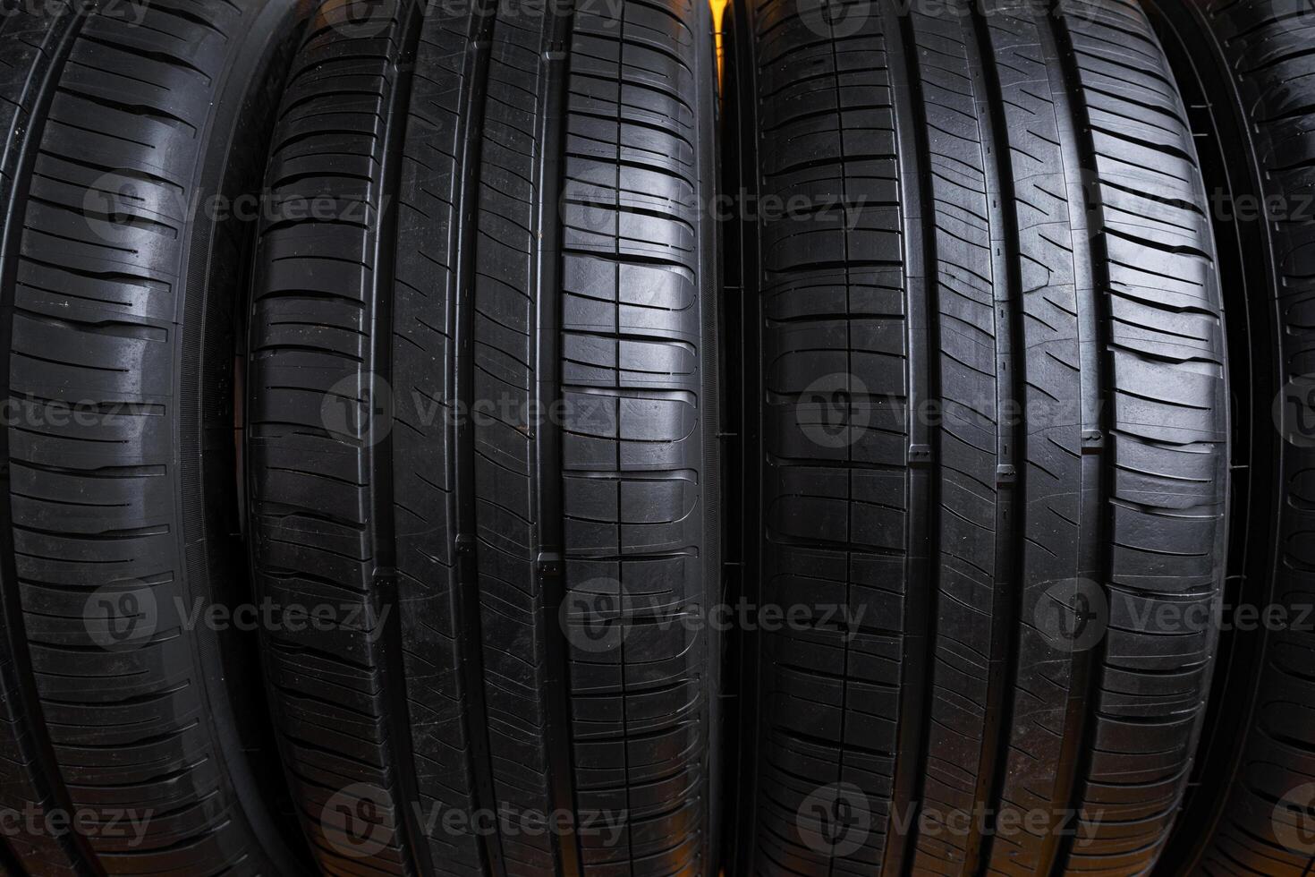 Row of new car tires close up. photo