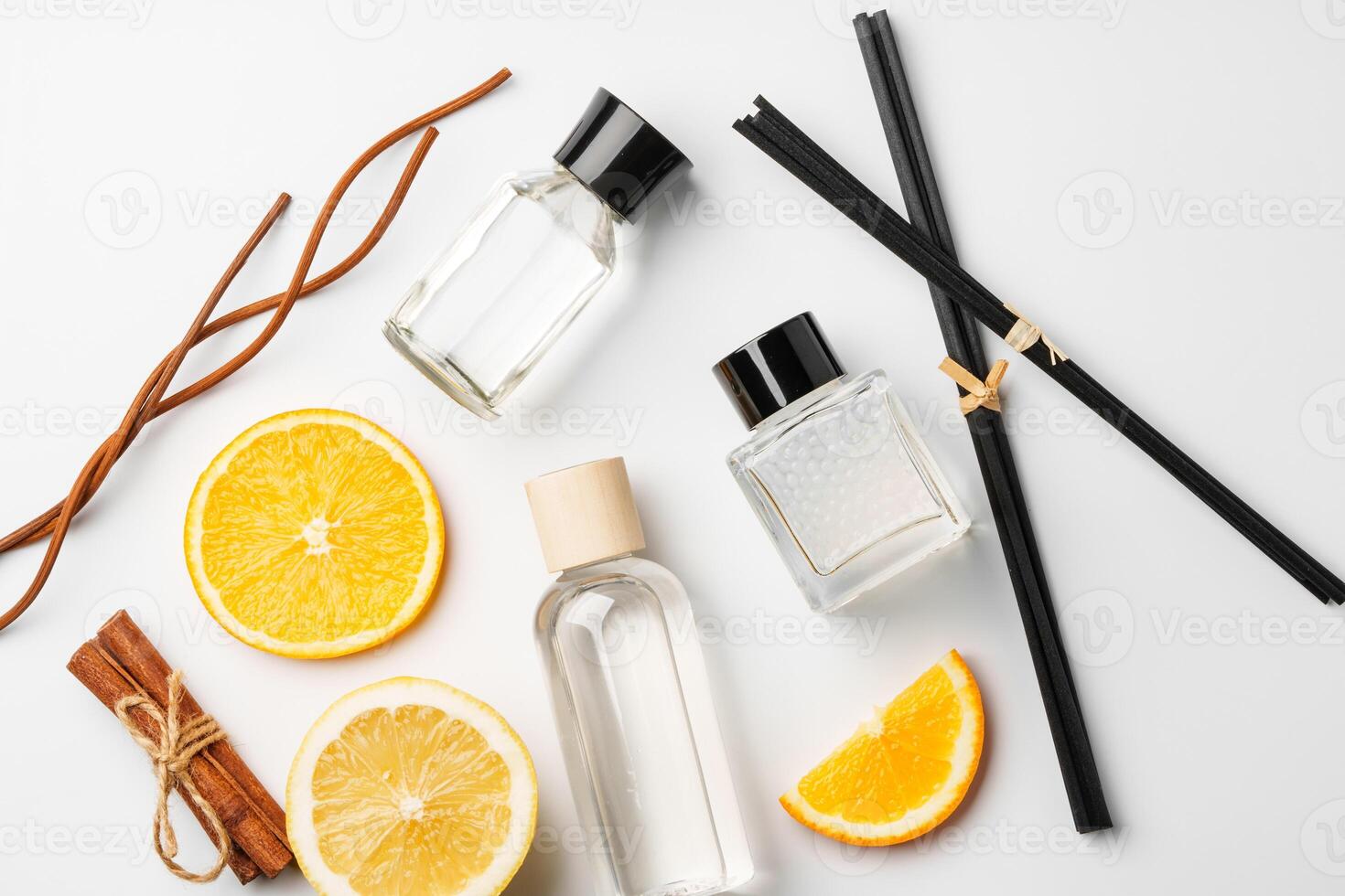 Aromatic display of essential oils with citrus fruit and chopsticks on a minimalist background photo