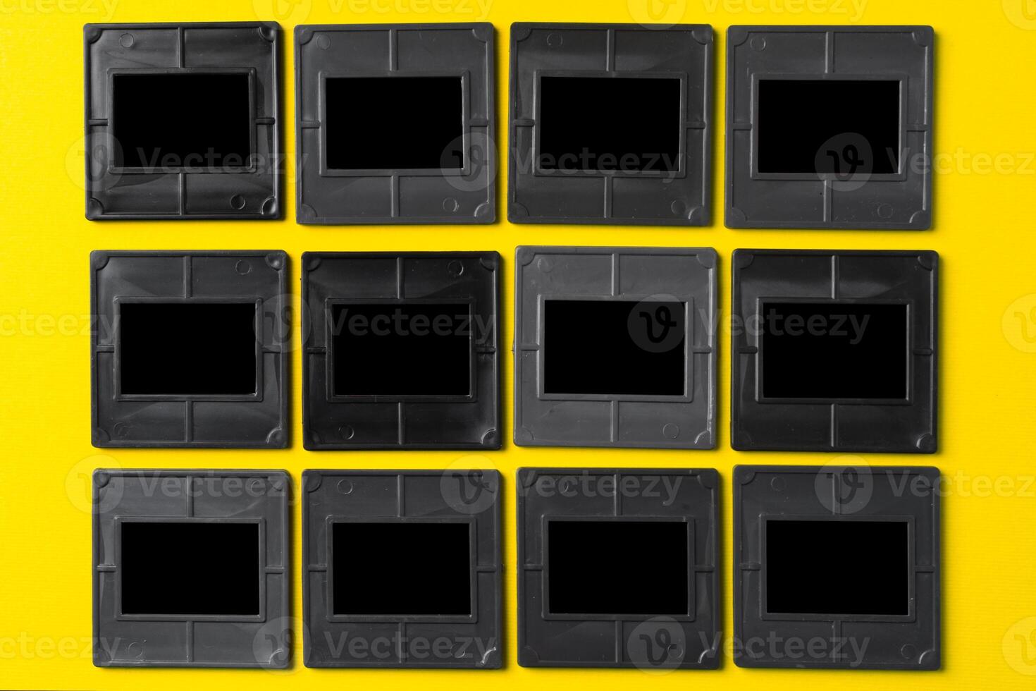 Photography empty slide frames on yellow background photo