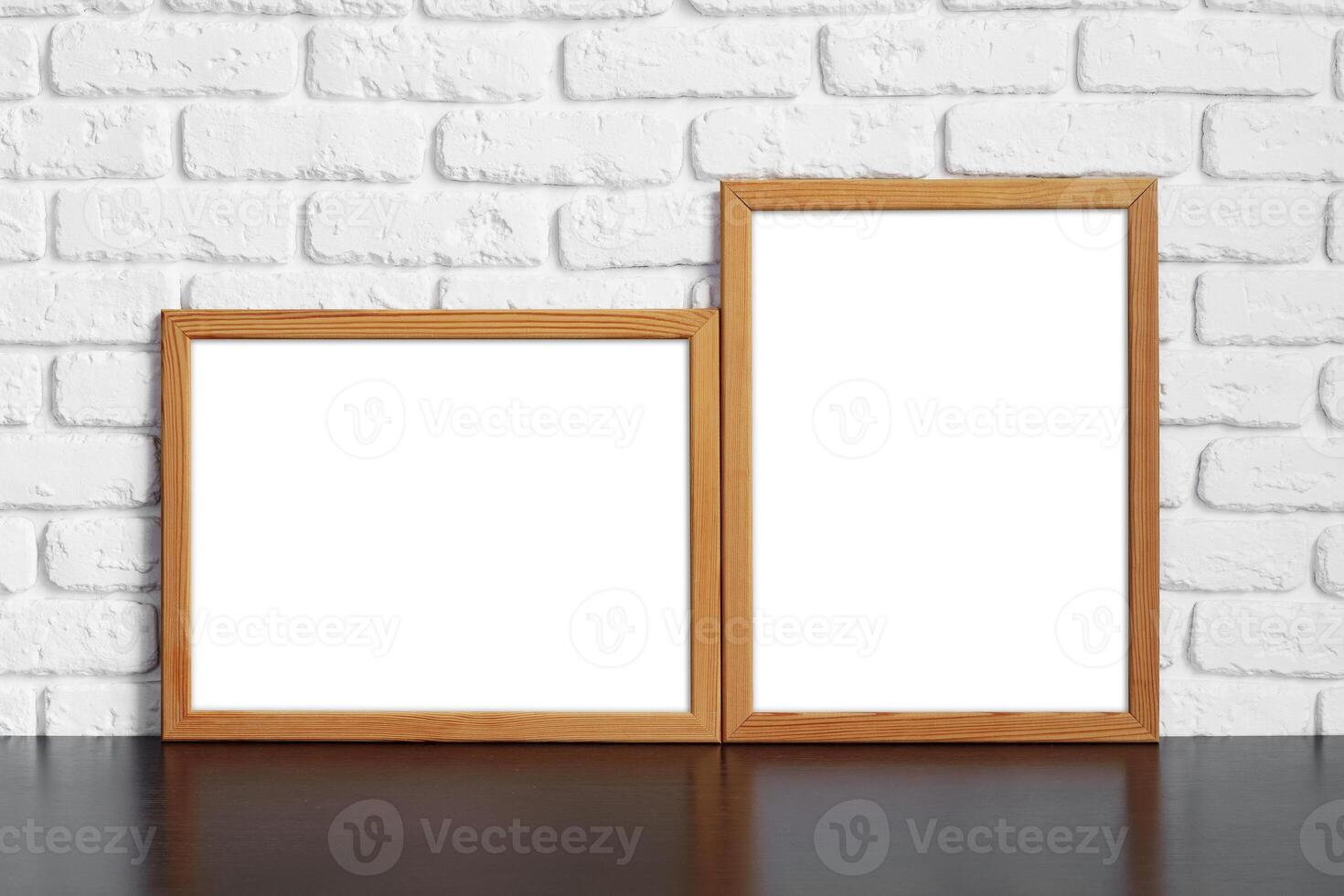 Blank picture frame against brick wall with copy space photo