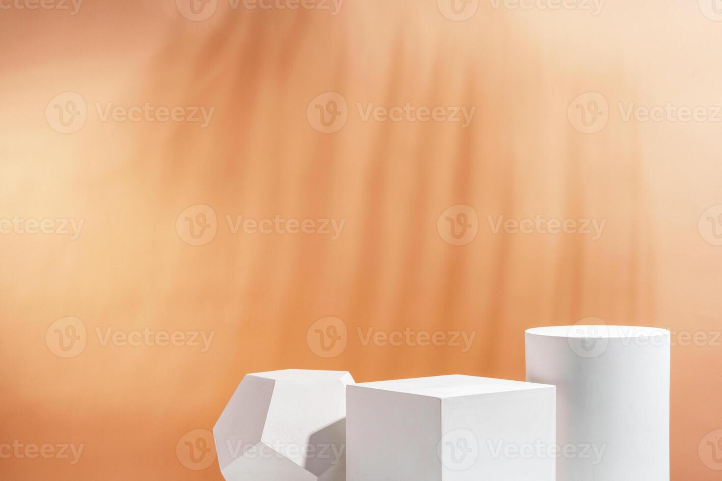 White geometric shapes arranged stylishly on a soft peach background in a minimalist setting photo