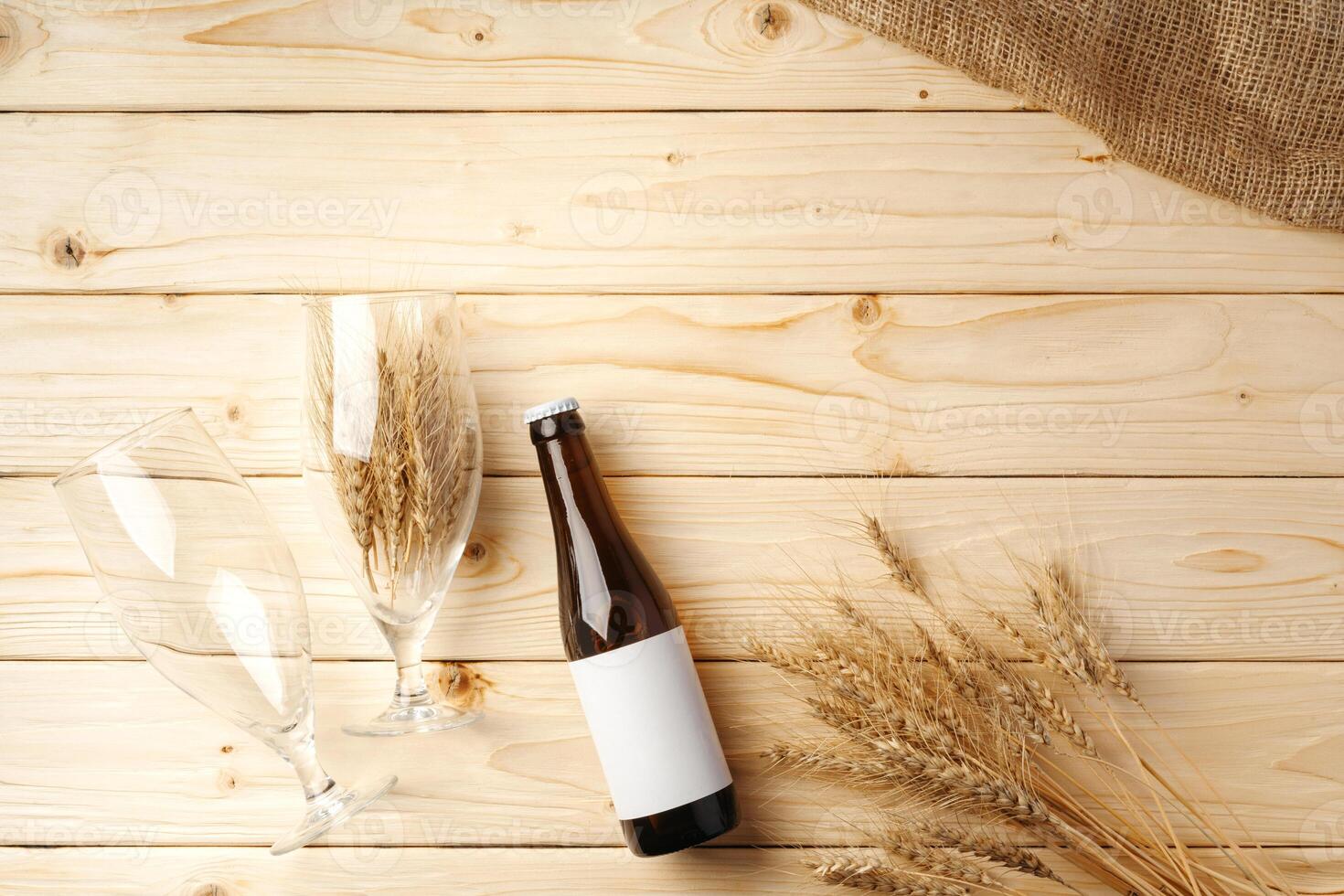 A bottle of beer and grain. Top view. Free space for text. photo