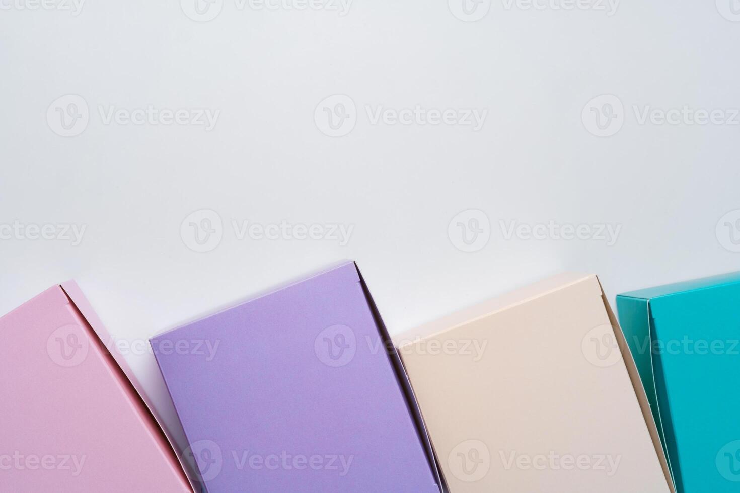 Pile of colorful cardboard boxes on white background photo