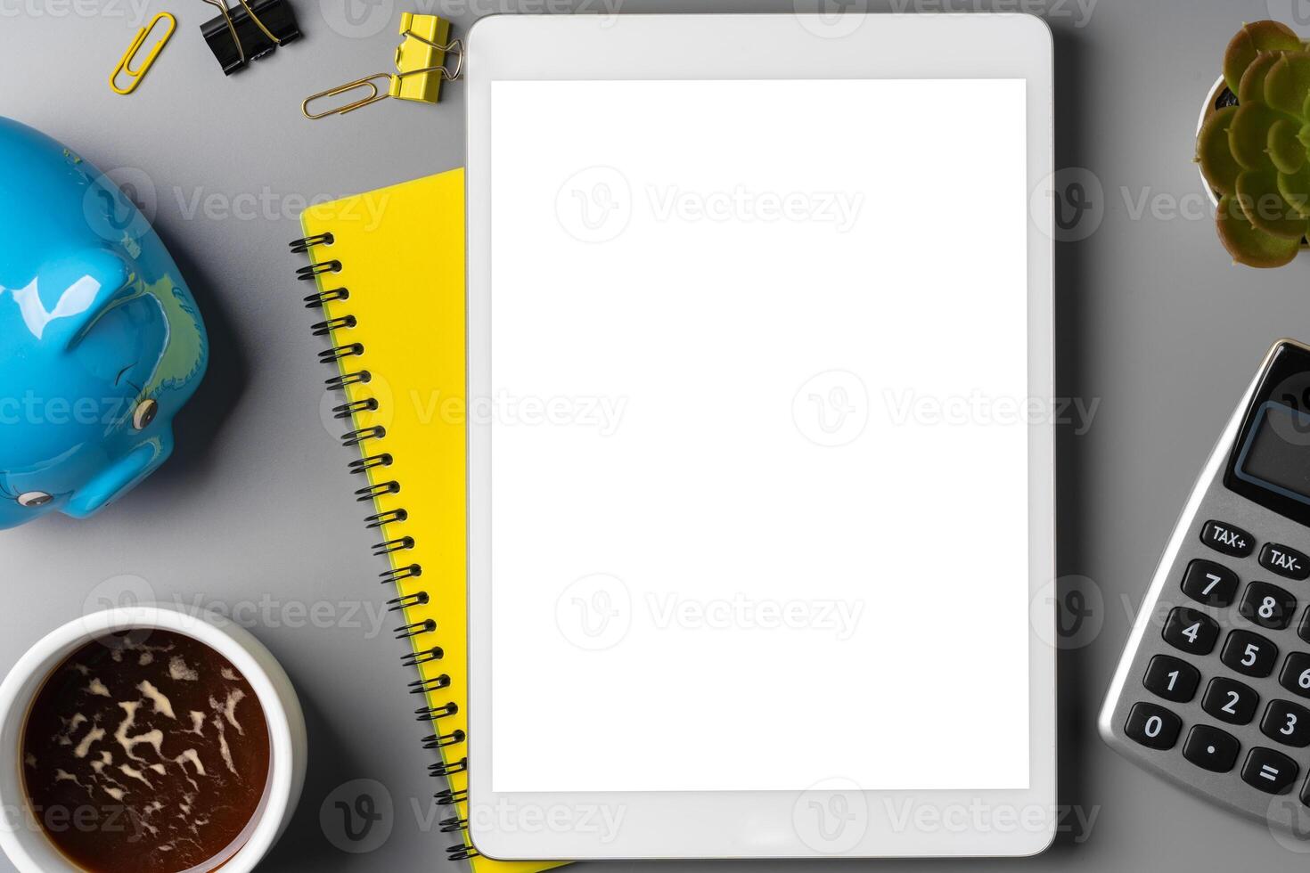 Minimal workplace with digital tablet and supplies photo