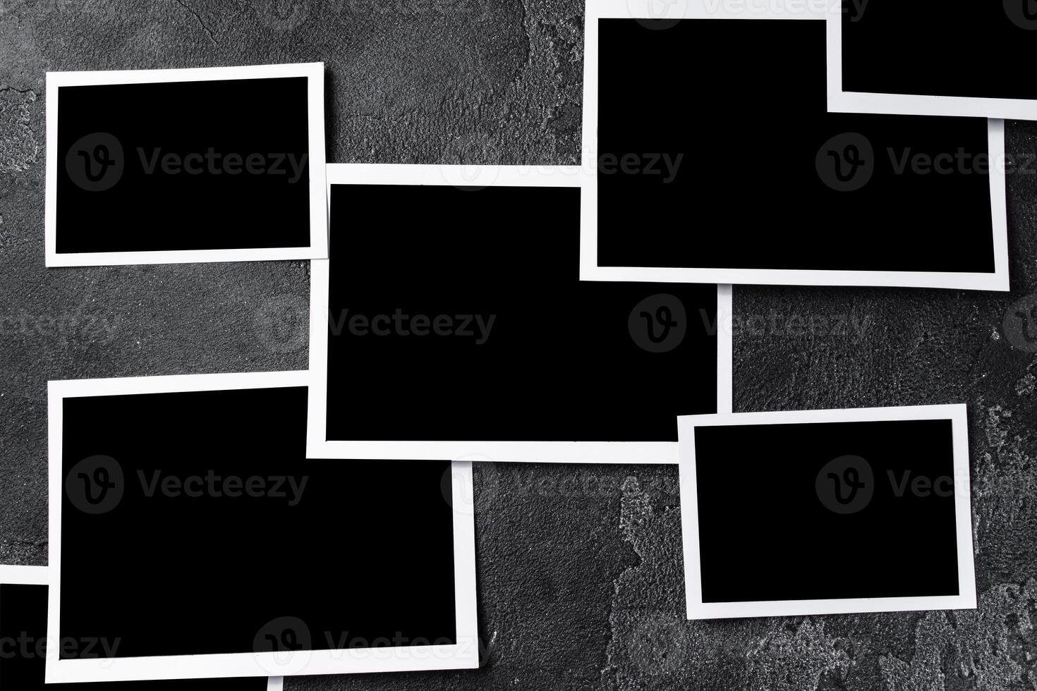 Paper photo frames with blank space on gray textured background