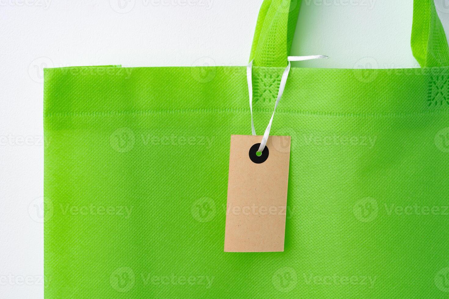 Eco bag for shopping with blank tag on white background photo