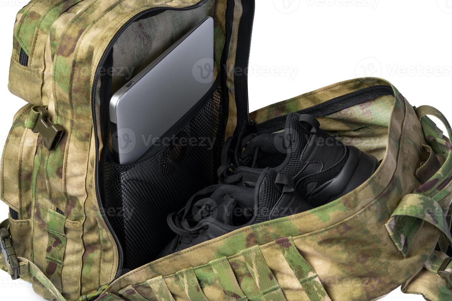 Open military backpack of khaki color on a white background photo