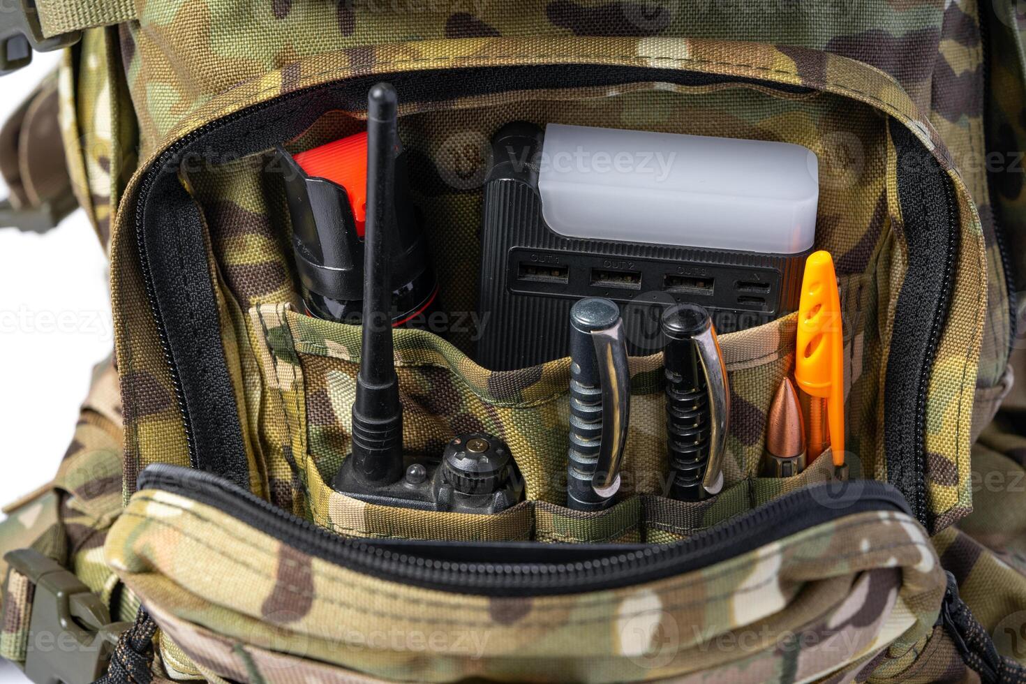 Open military backpack of khaki color on a white background photo