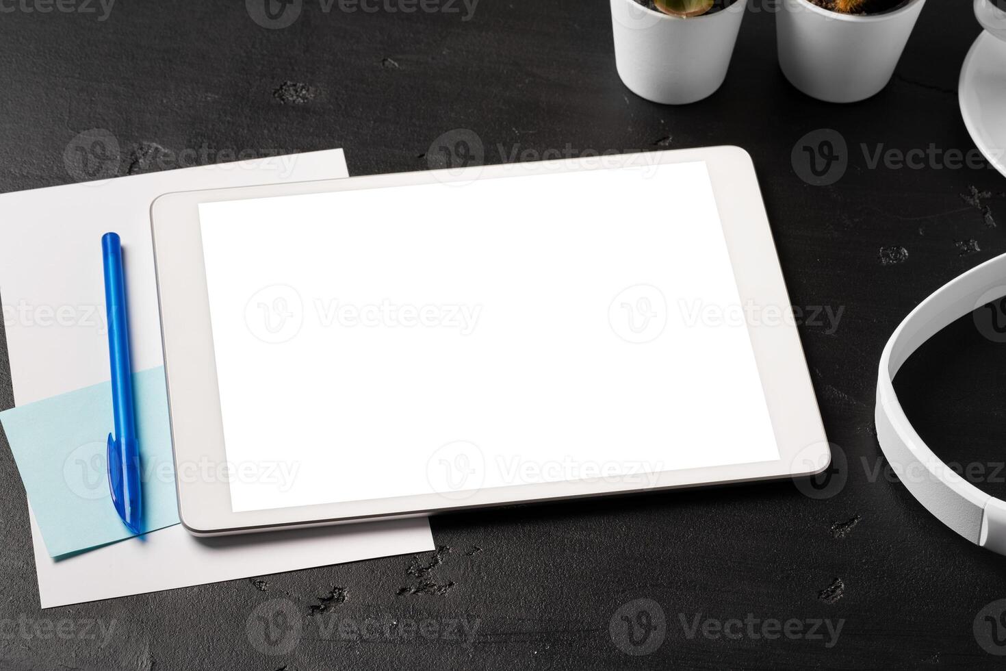 Minimal workplace with digital tablet and supplies photo