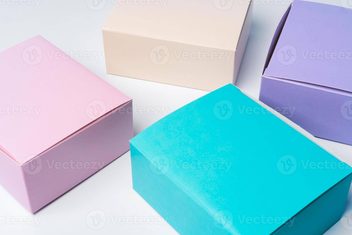 Pile of colorful cardboard boxes on white background photo