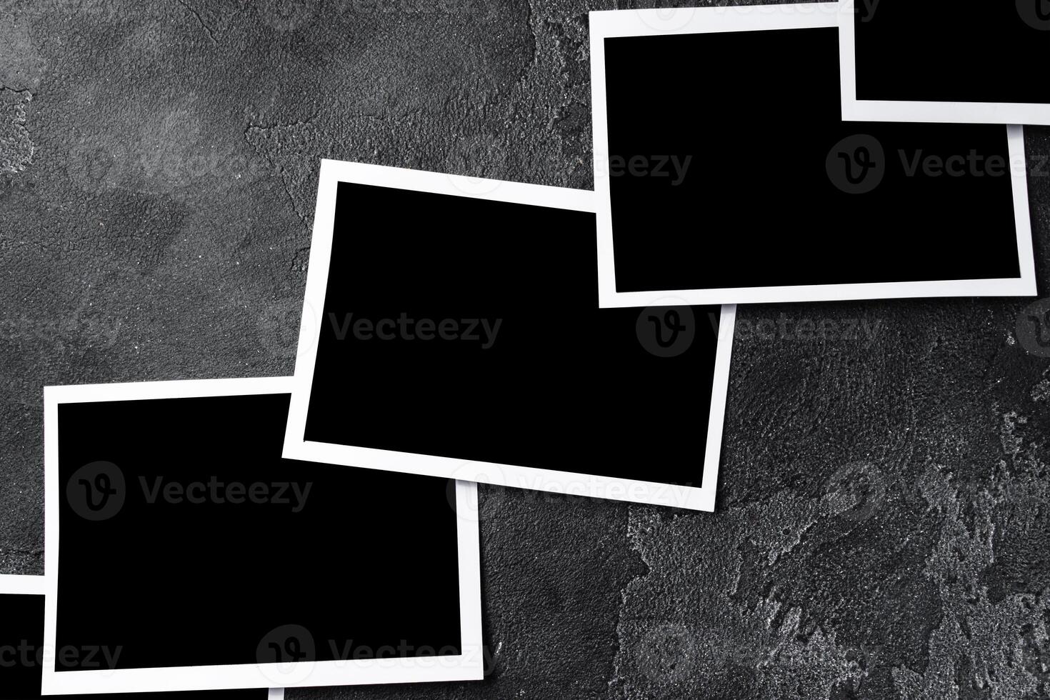 Paper photo frames with blank space on gray textured background