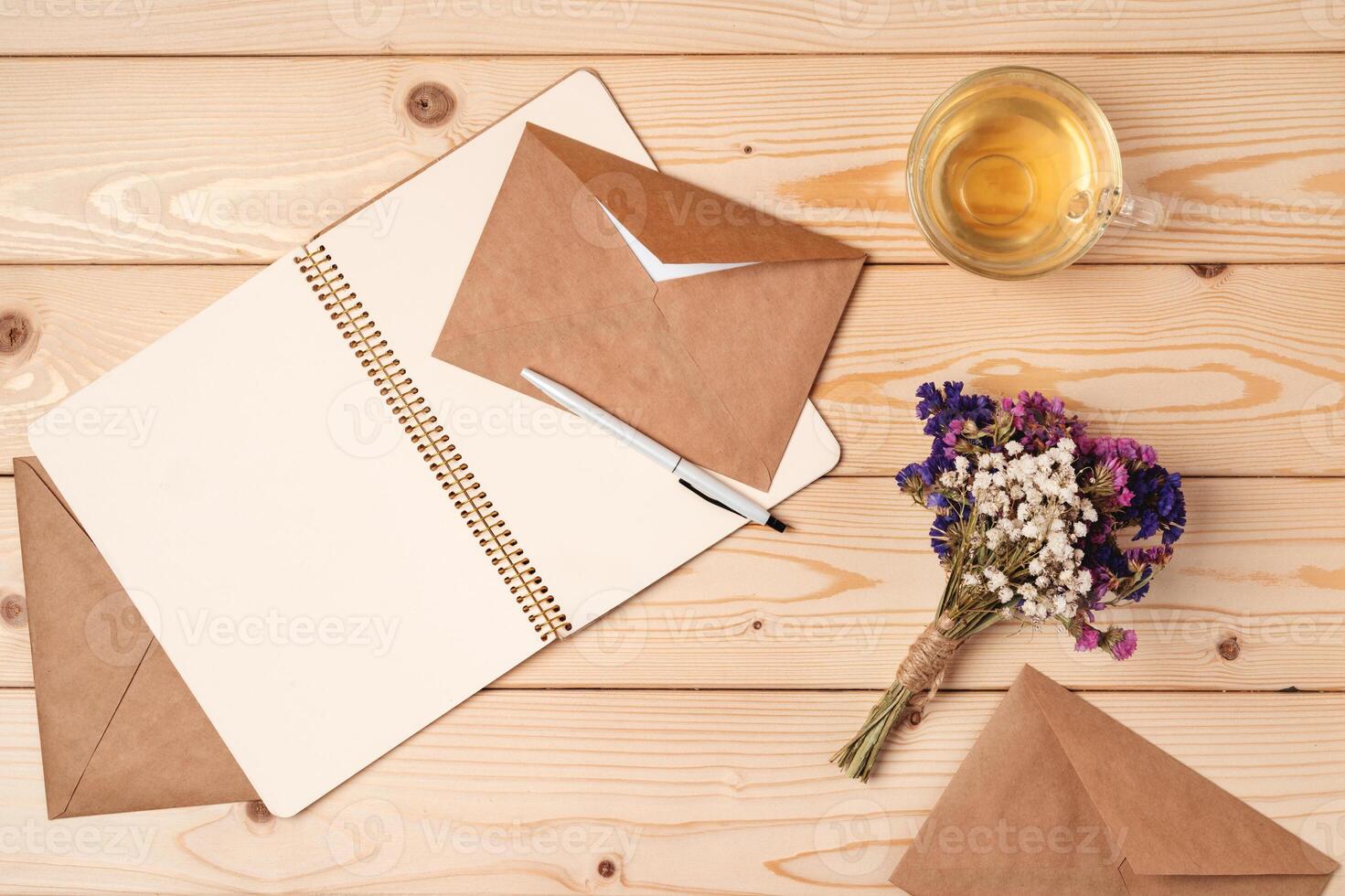 envelope and blank paper card with copy space mock up. photo