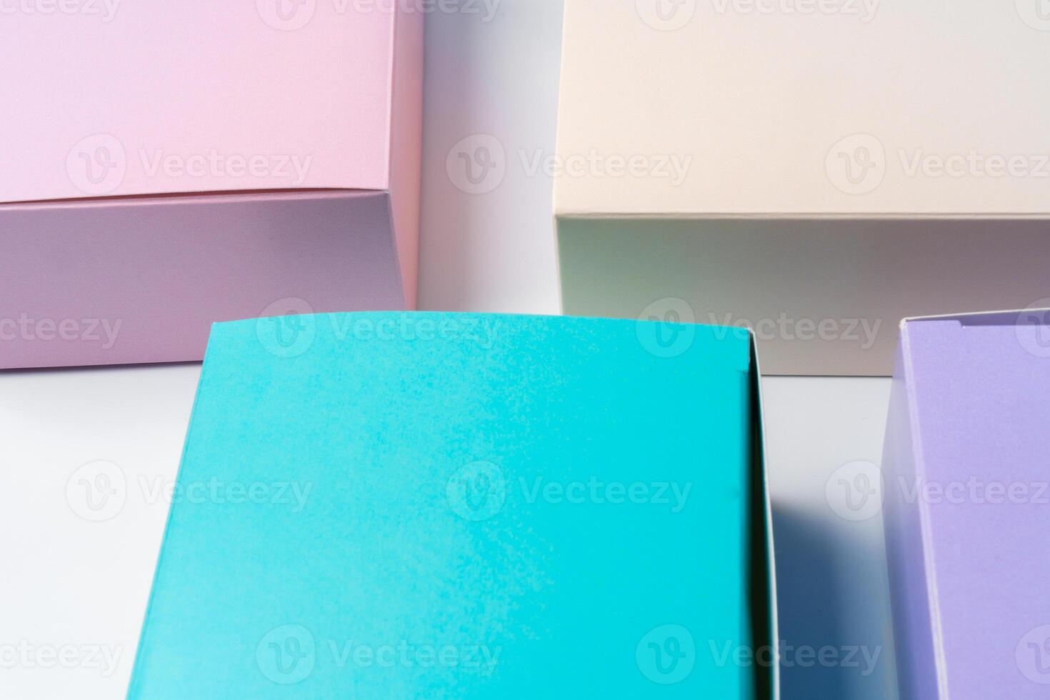 Pile of colorful cardboard boxes on white background photo