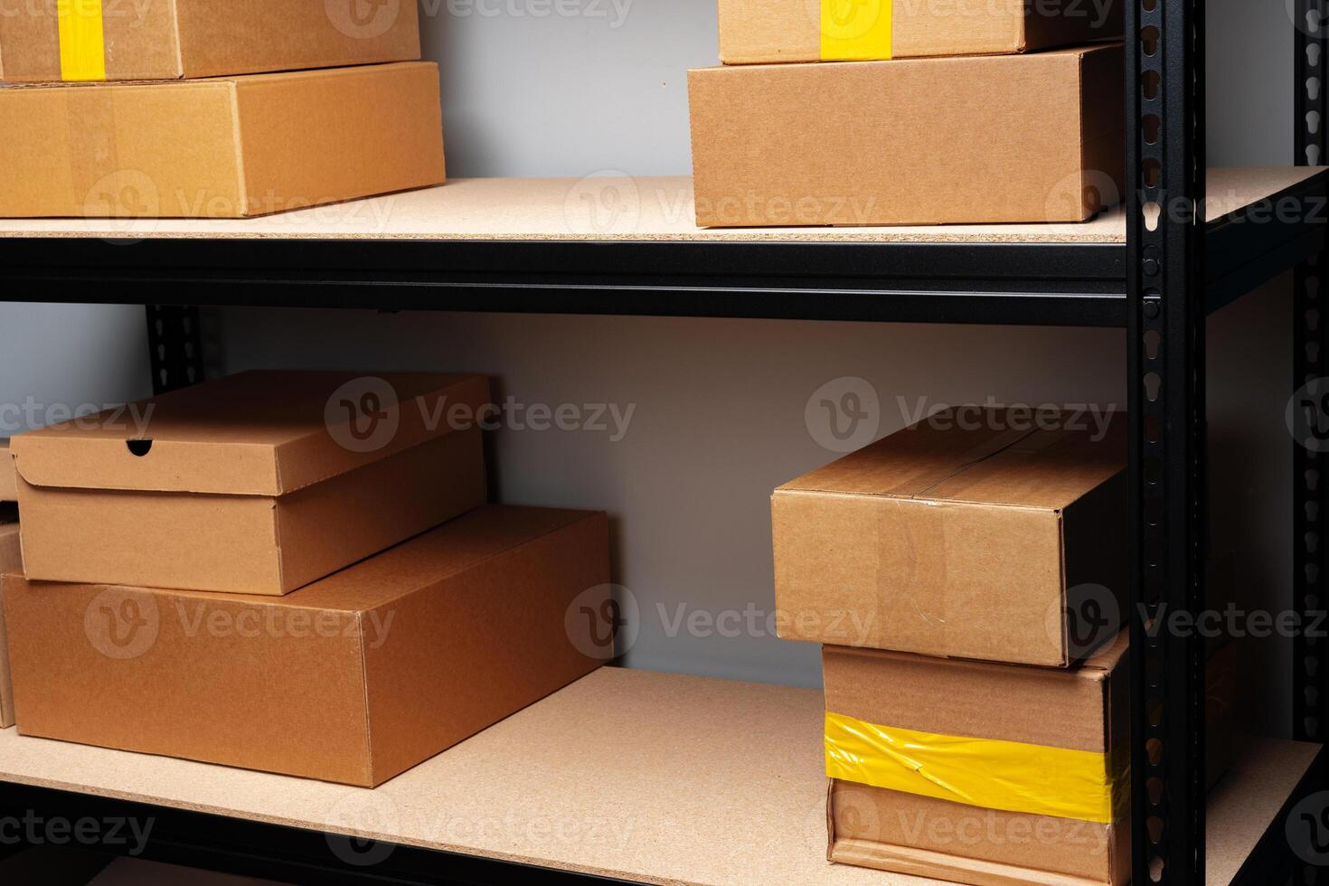 Rack shelves with paper boxes in warehouse. photo