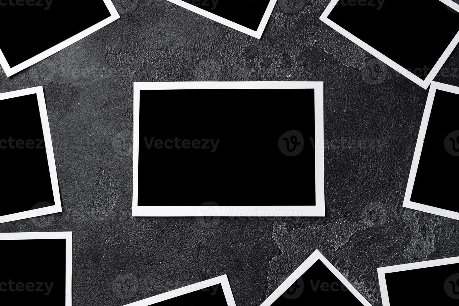 Paper photo frames with blank space on gray textured background