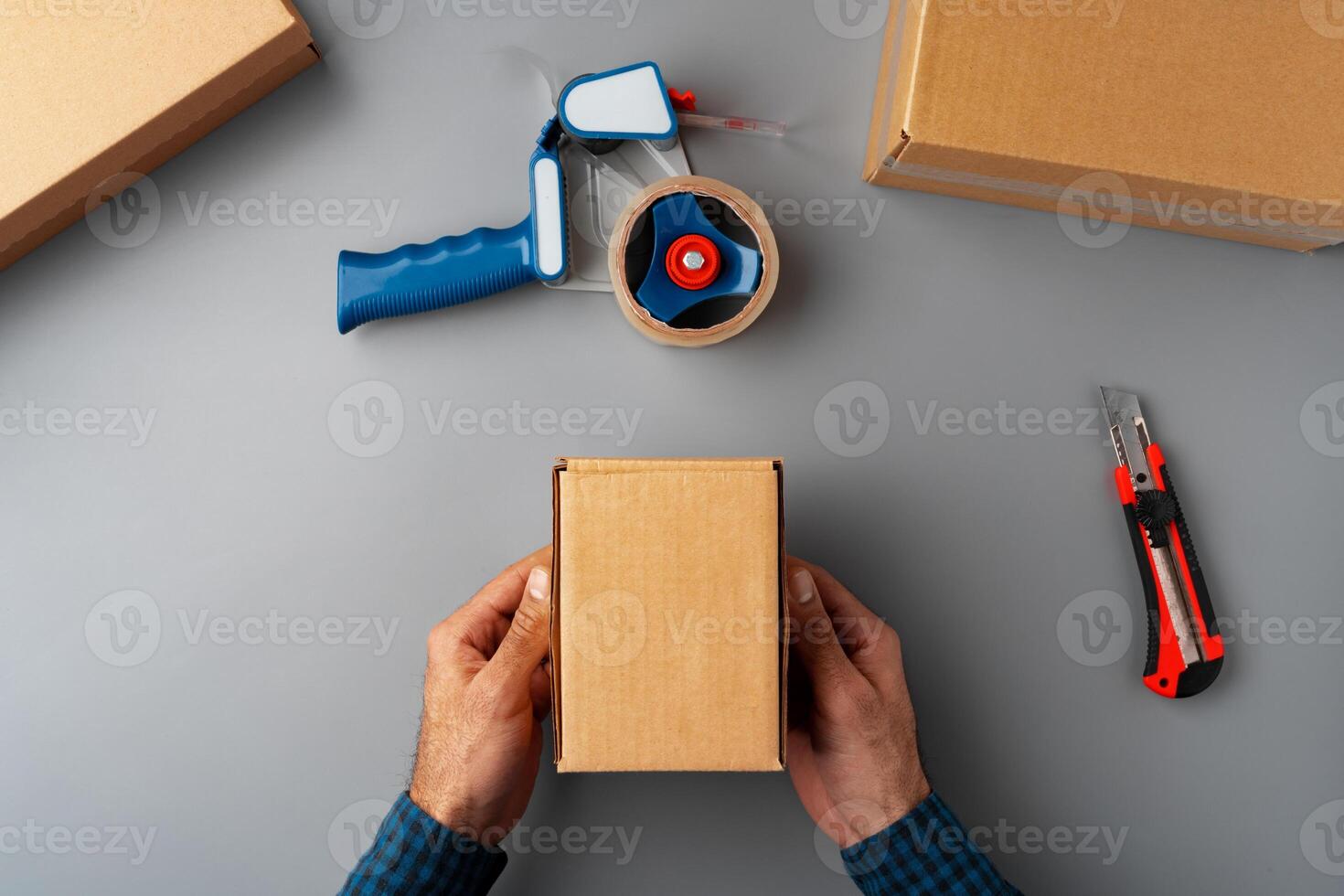 Above table top view of warehouse preparing post courier delivery package photo