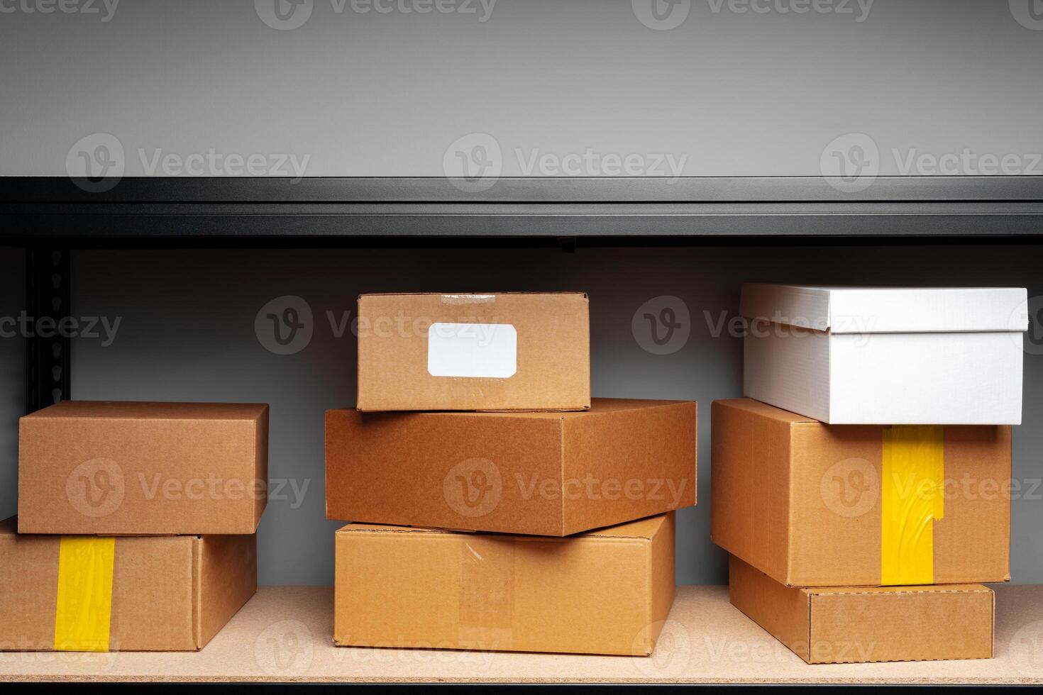 Rows of shelves with cardboard boxes in modern warehouse photo
