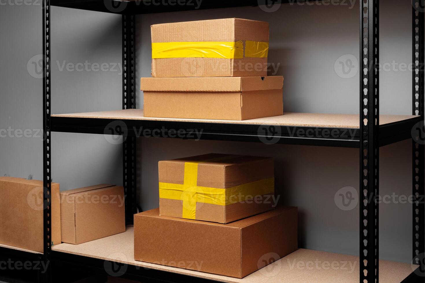 Rack shelves with paper boxes in warehouse. photo