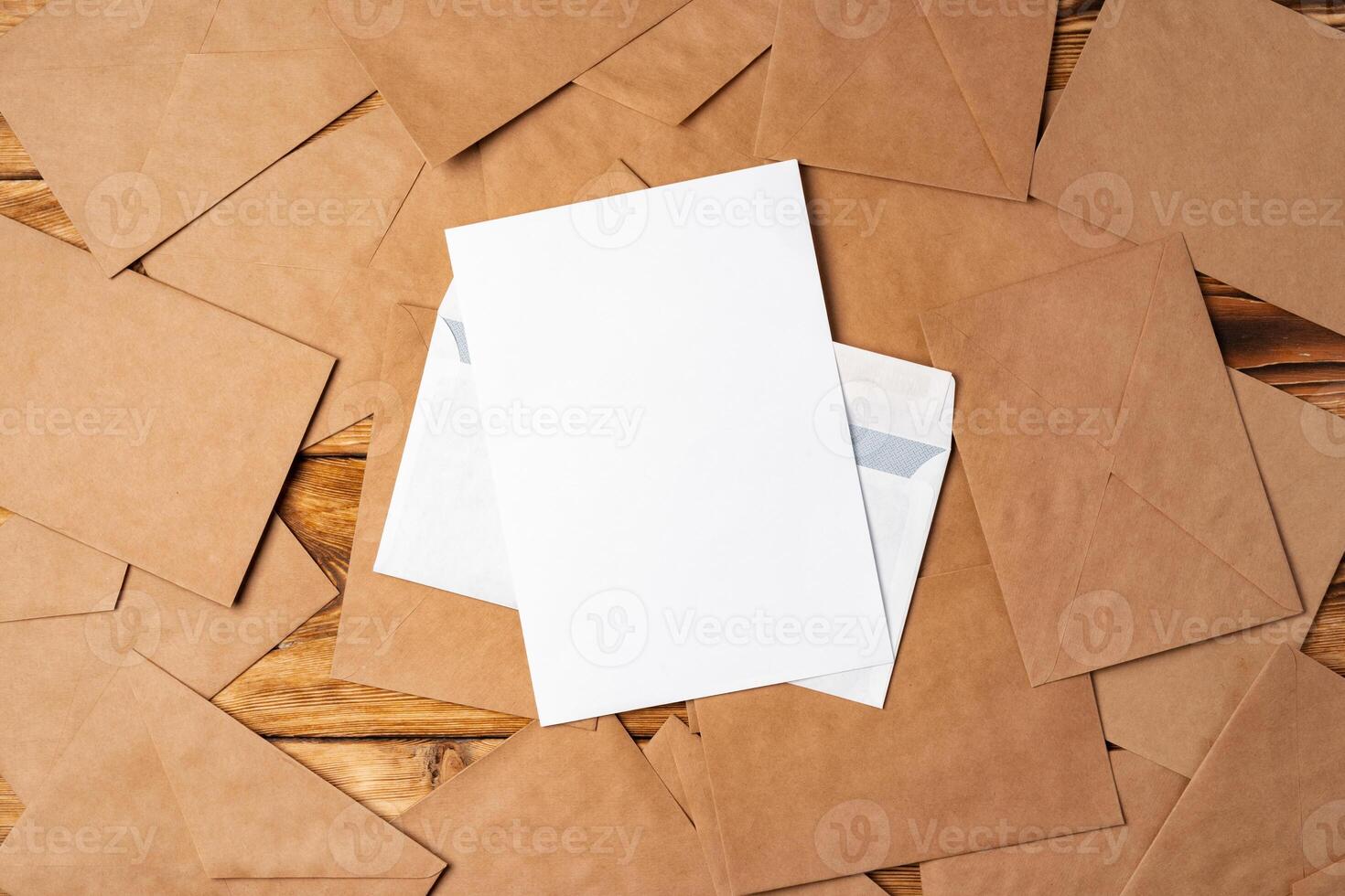Stack of envelopes on working desk top view. Business mail photo