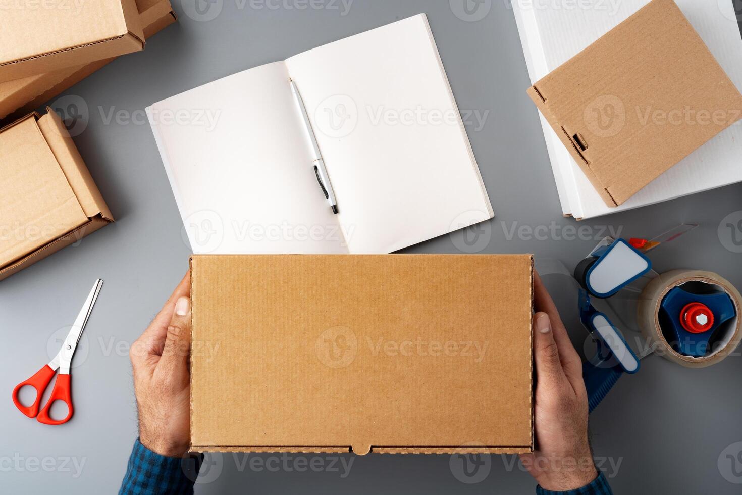 Above table top view of warehouse preparing post courier delivery package photo