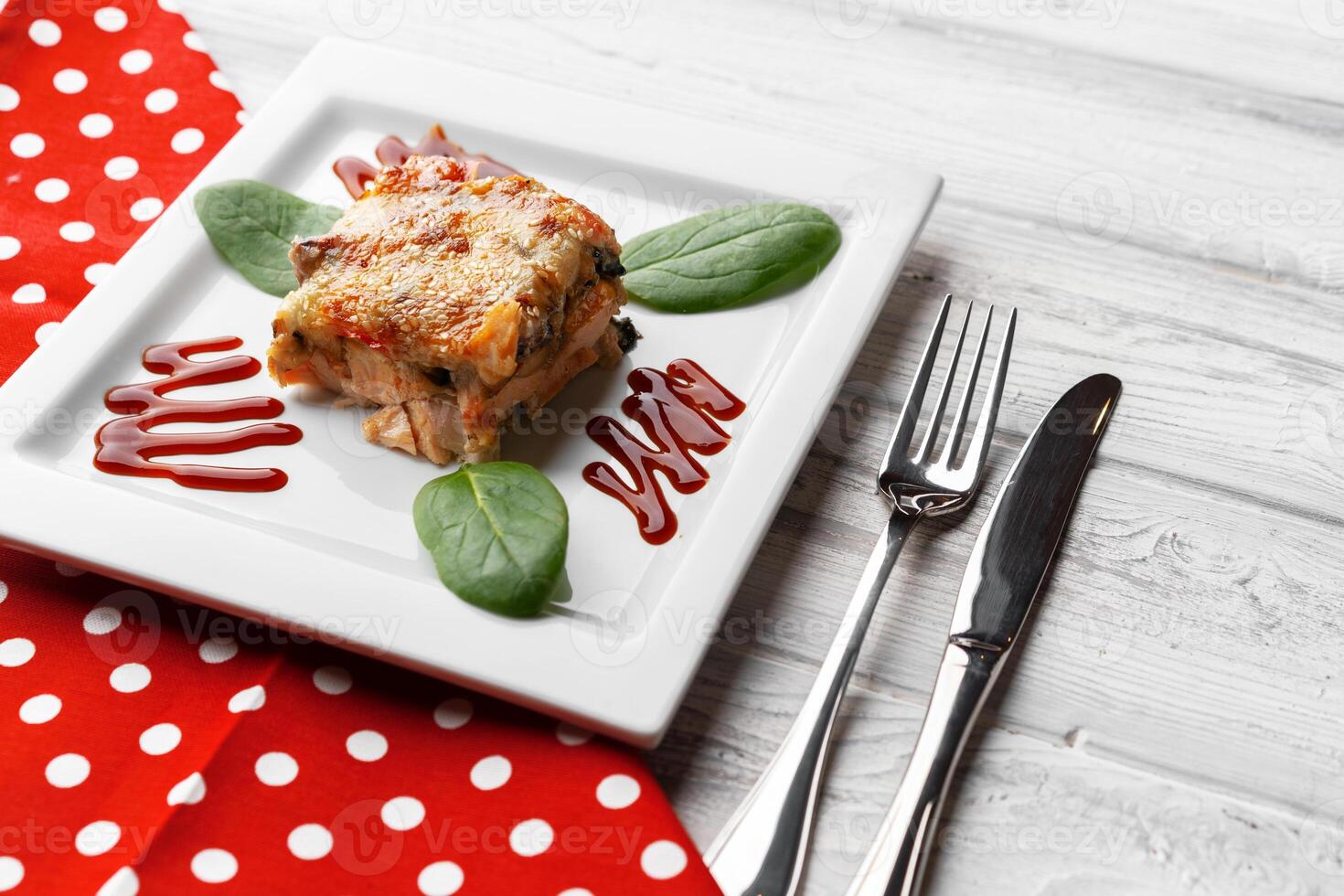 Delicious veal cutlet with melted mozzarella cheese on white plate photo