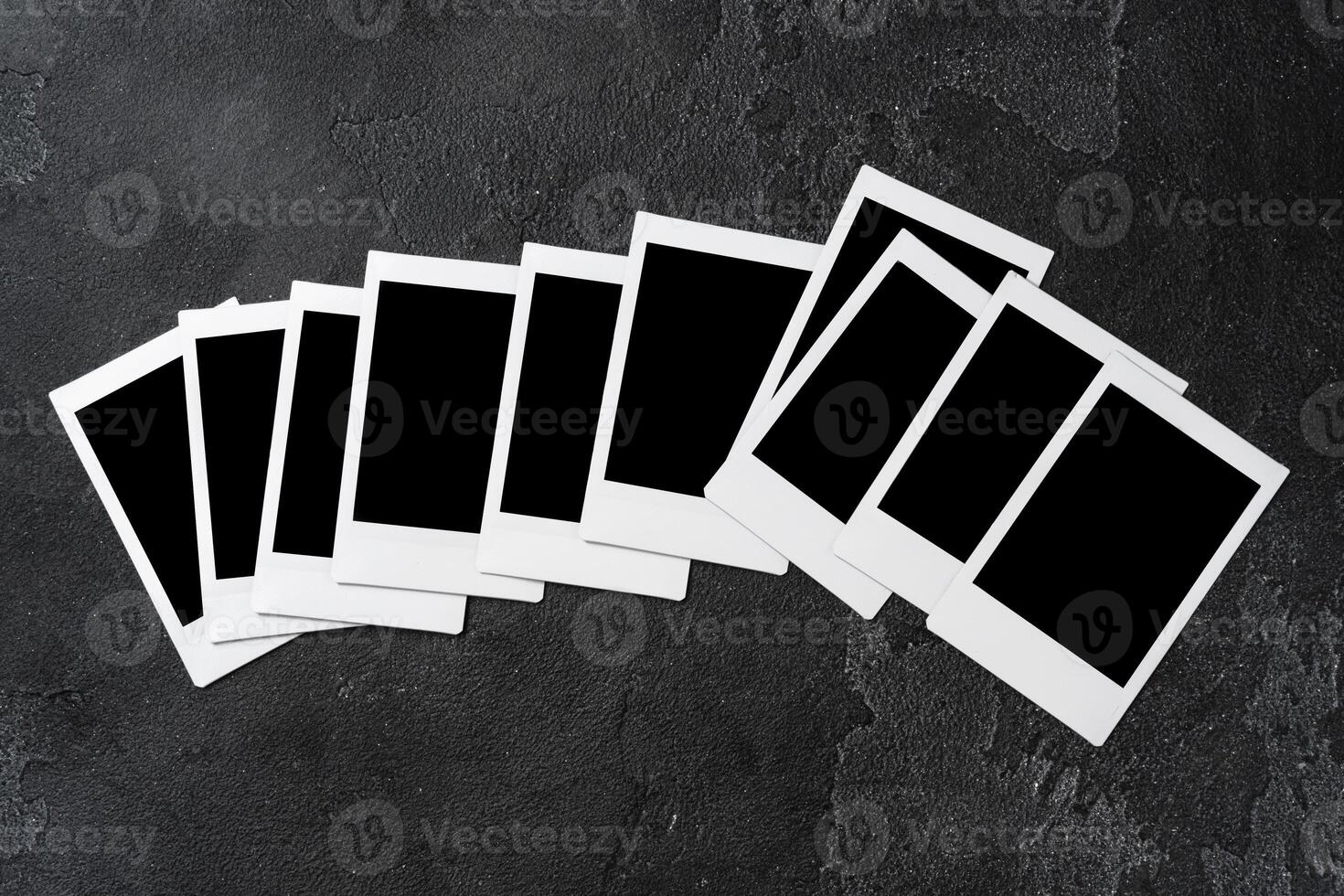 Paper photo frames with blank space on gray textured background