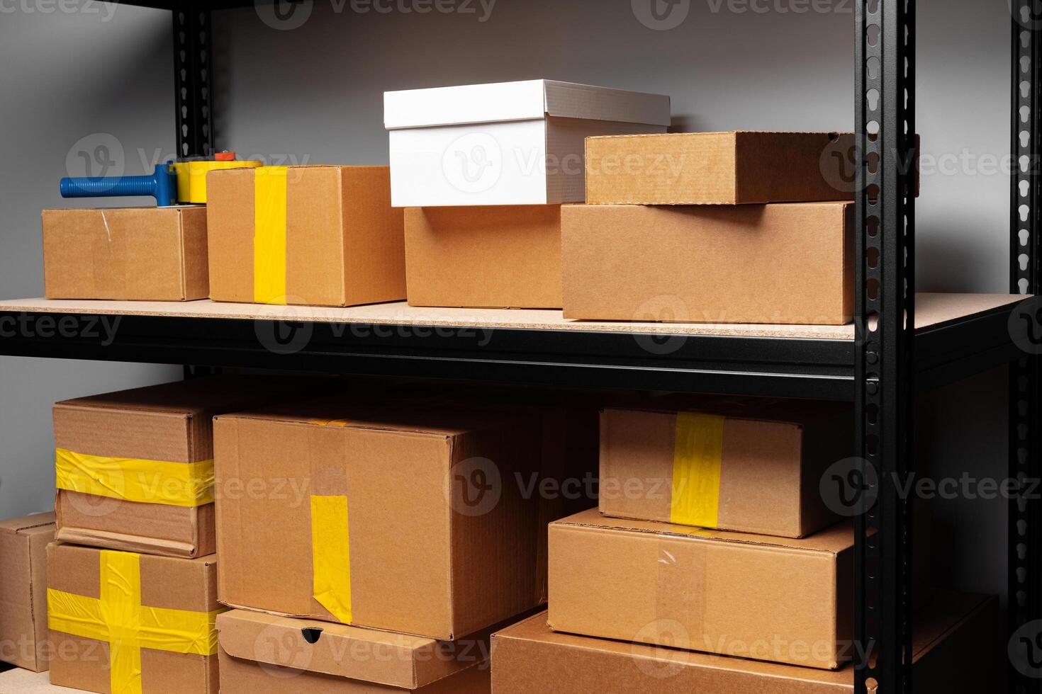 Rack shelves with paper boxes in warehouse. photo