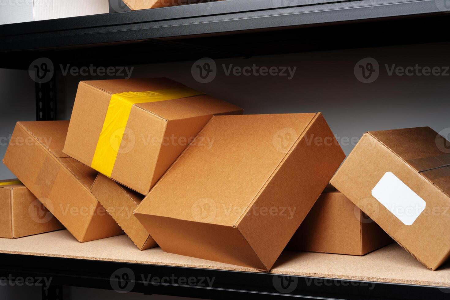 Rows of shelves with cardboard boxes in modern warehouse photo