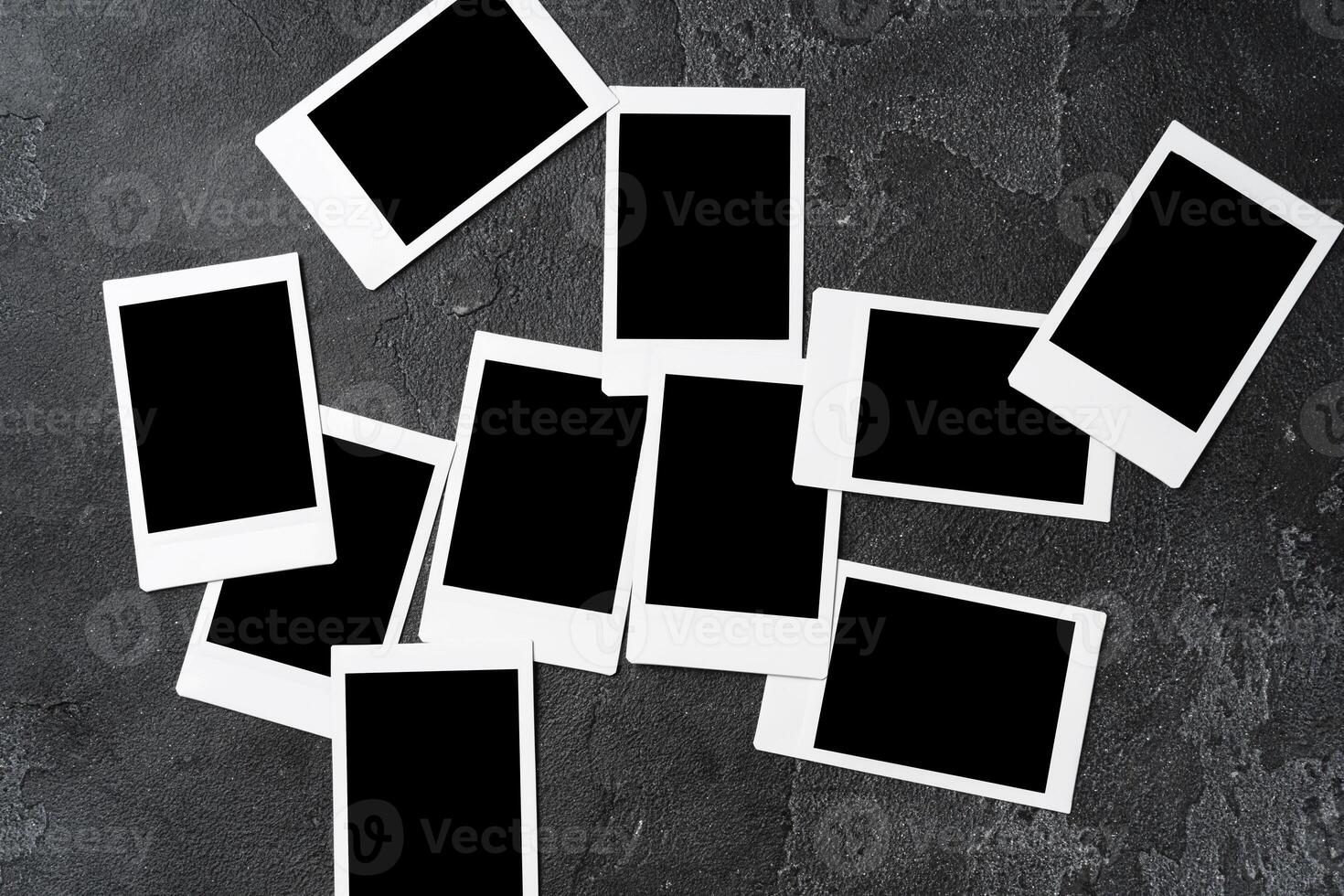 Paper photo frames with blank space on gray textured background