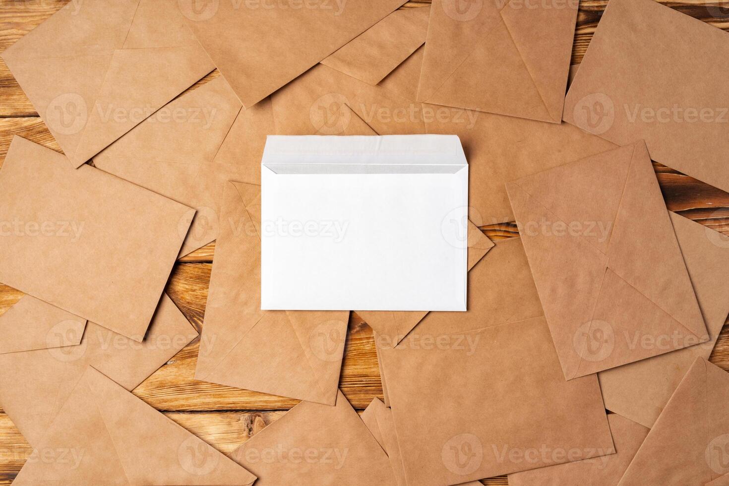Stack of envelopes on working desk top view. Business mail photo