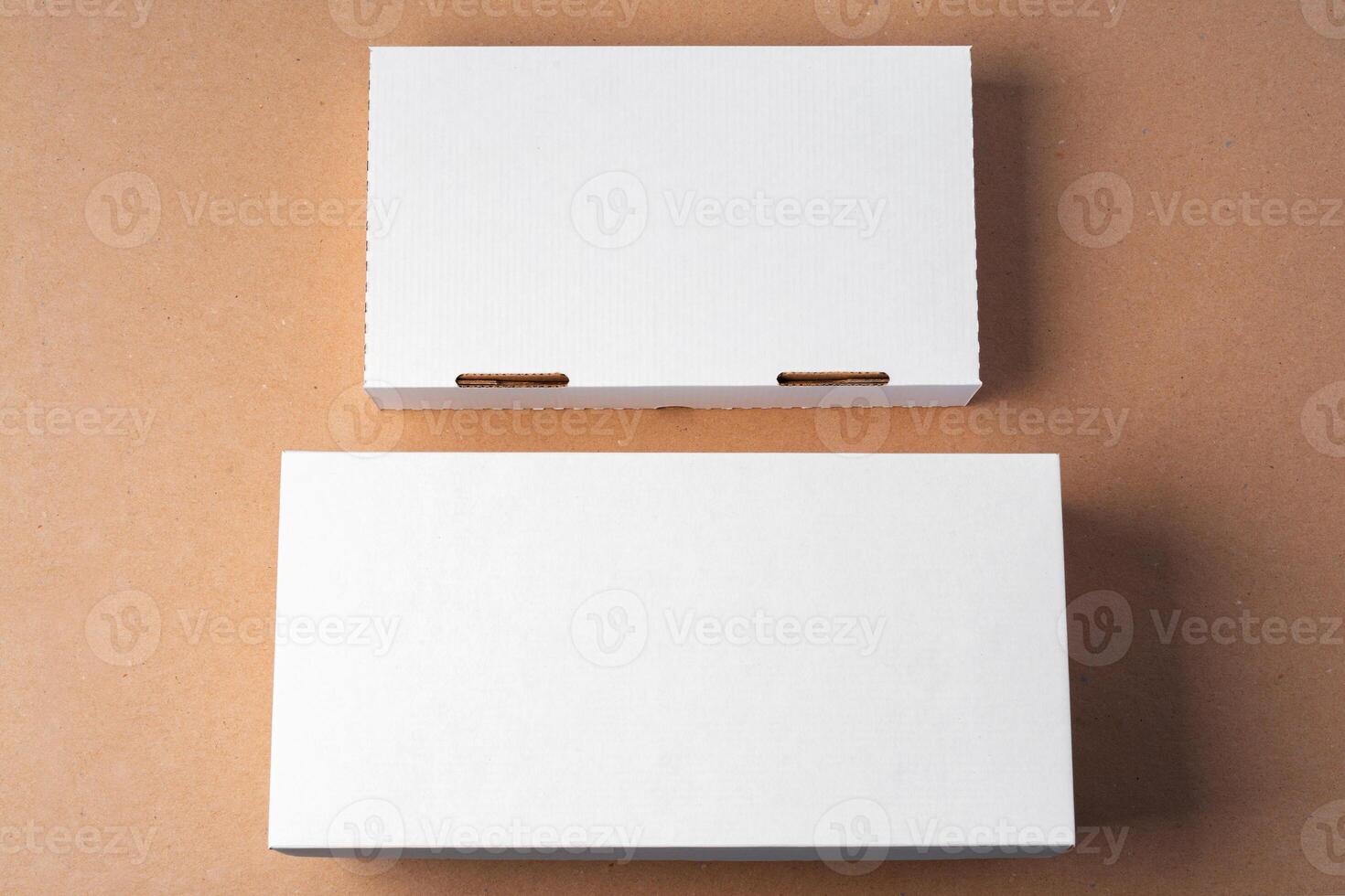 Cardboard box on beige background in studio photo