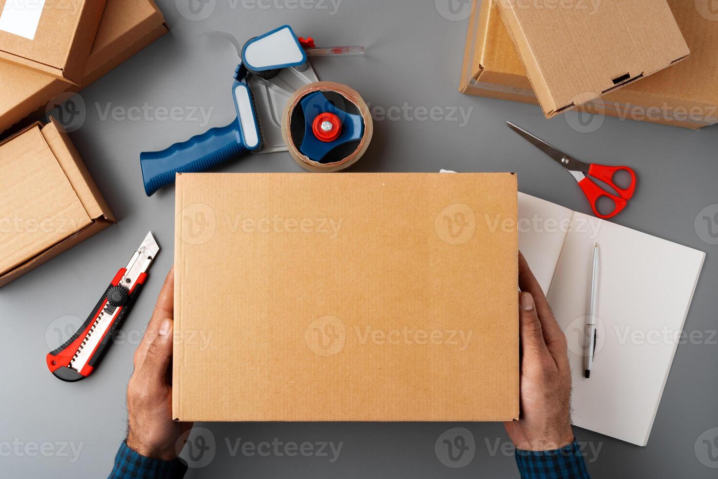 Above table top view of warehouse preparing post courier delivery package photo