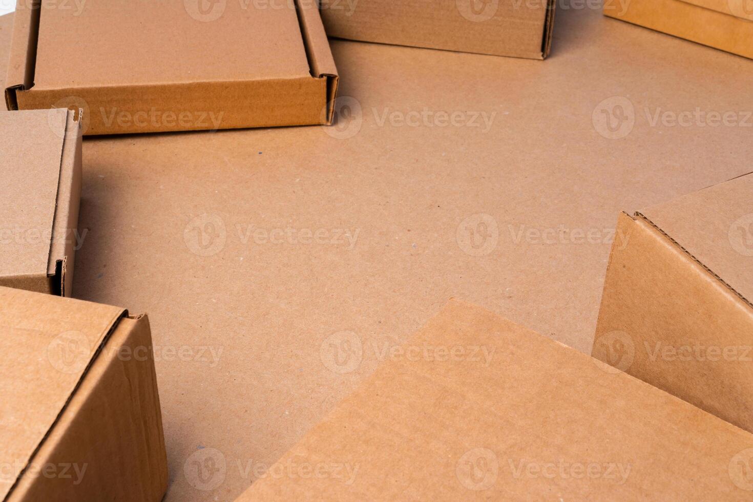 Cardboard box on beige background in studio photo