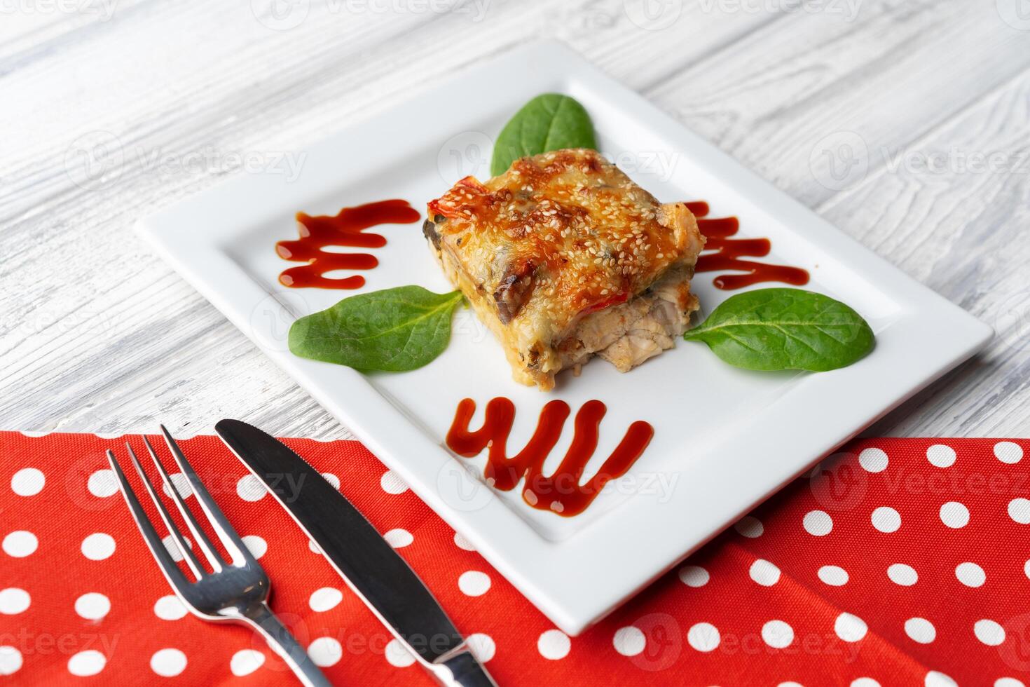 Delicious veal cutlet with melted mozzarella cheese on white plate photo