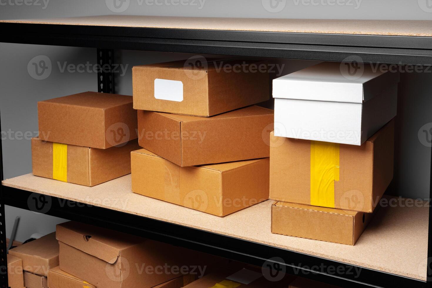Rows of shelves with cardboard boxes in modern warehouse photo